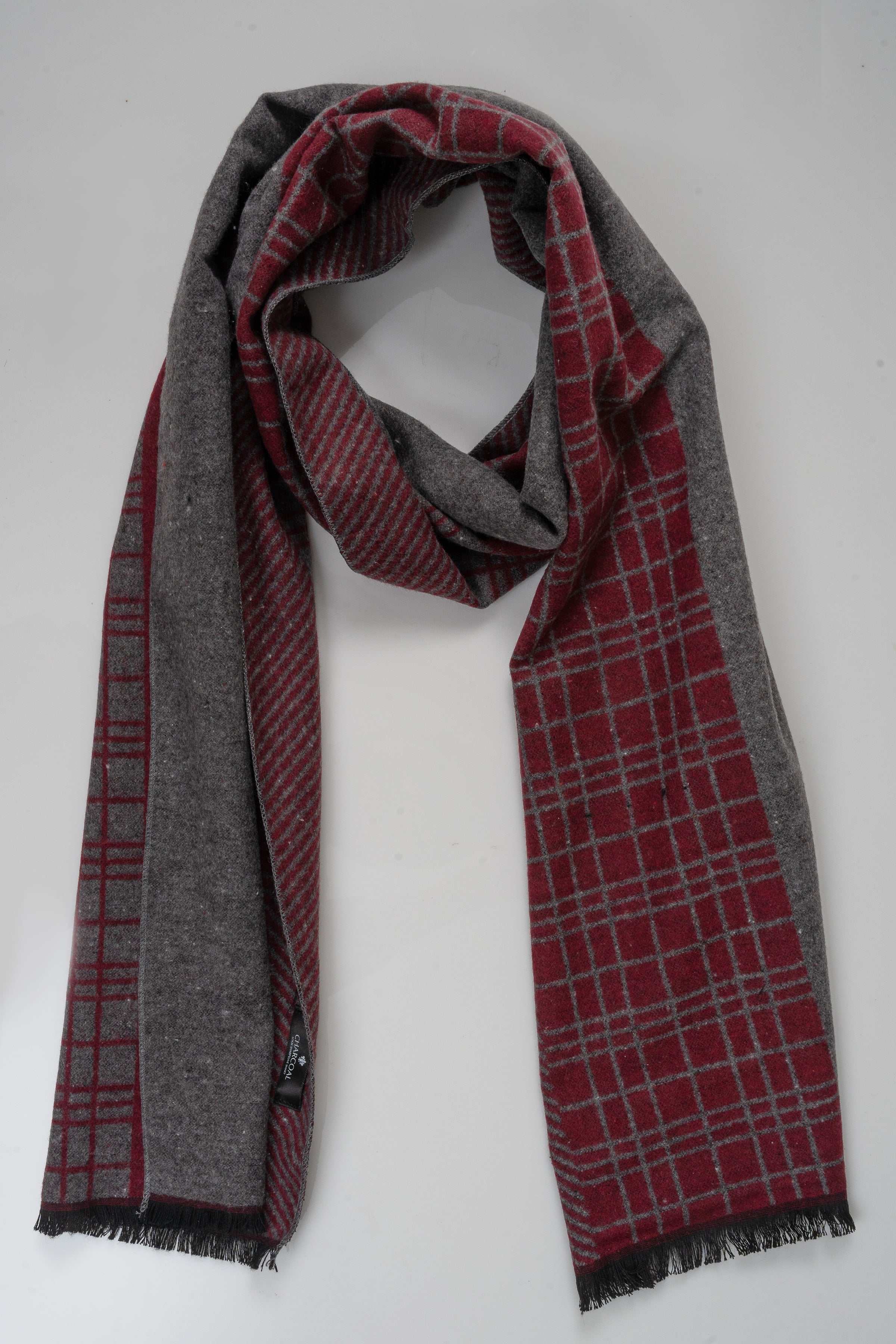 Plaid scarf with red grid and charcoal gray, fringed edges