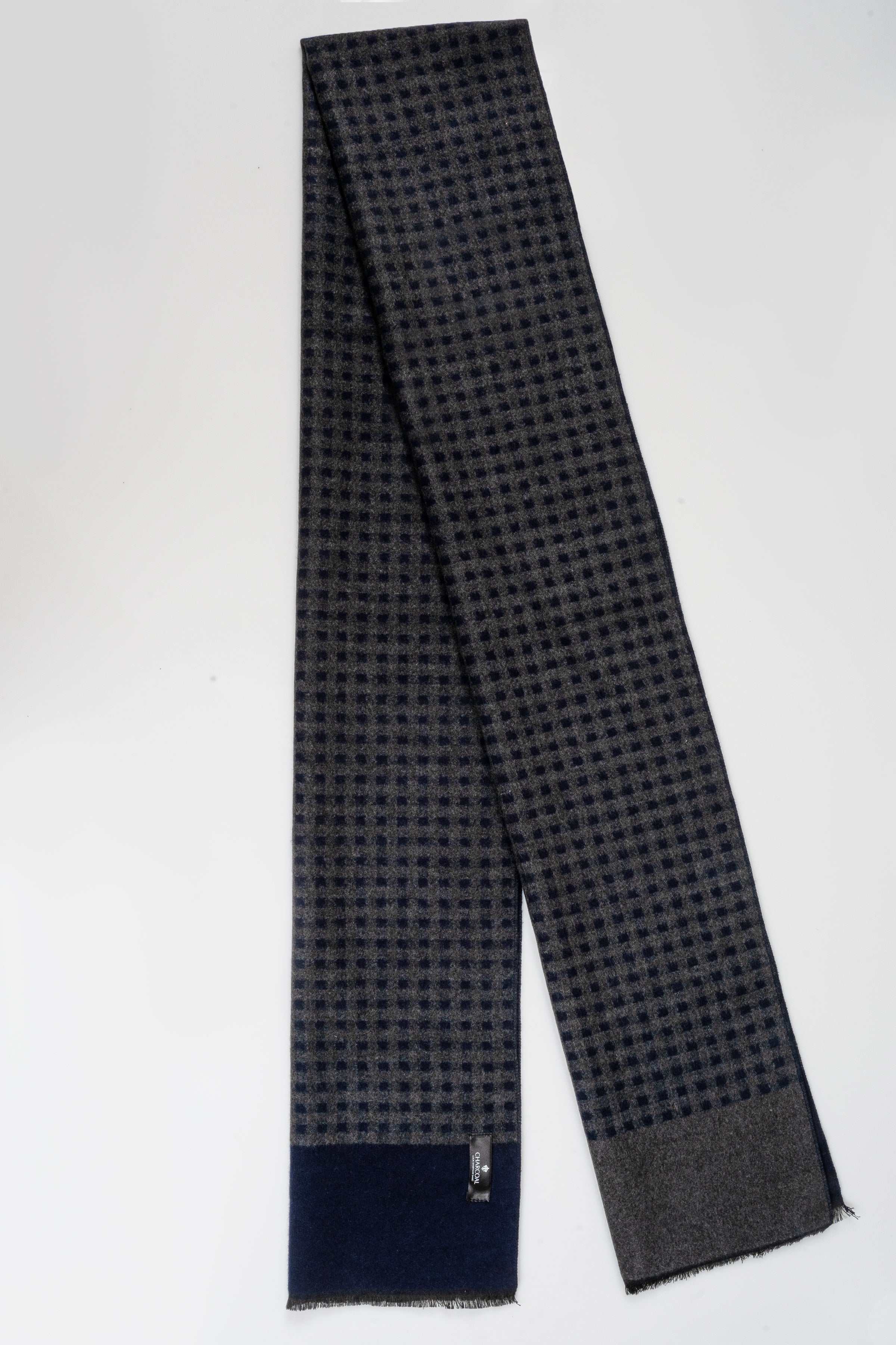 Navy check-pattern scarf with solid dark border and fringed ends.