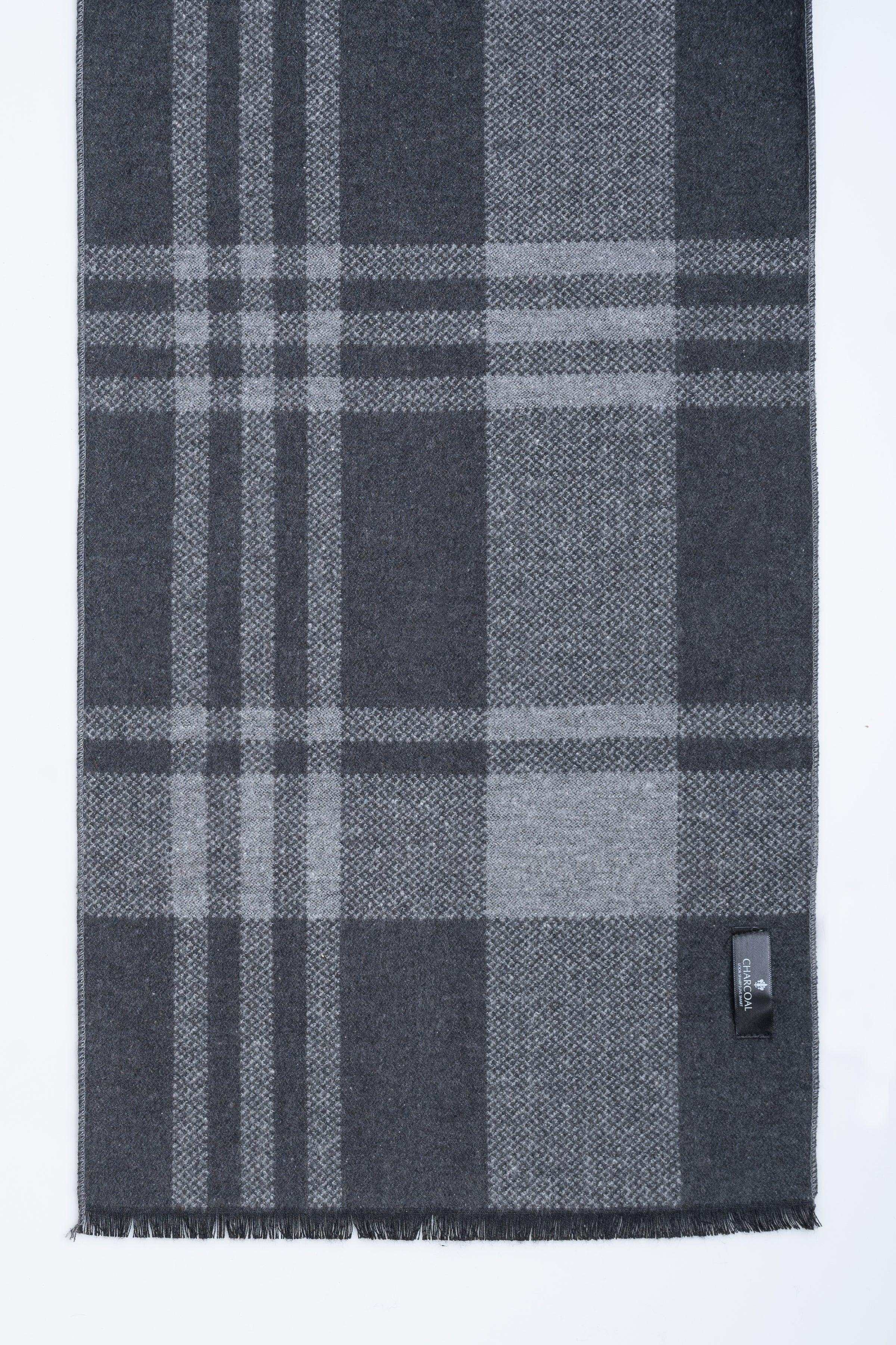 Dark gray plaid scarf with fringe ends and small logo label