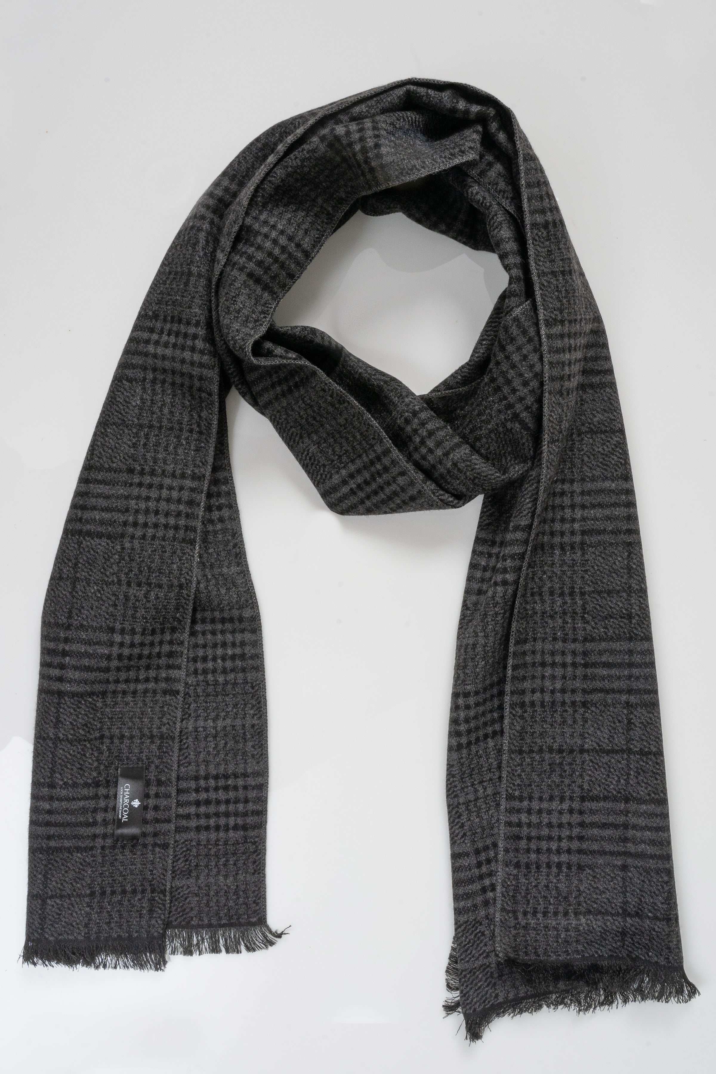 Charcoal plaid scarf, draped with fringed edges