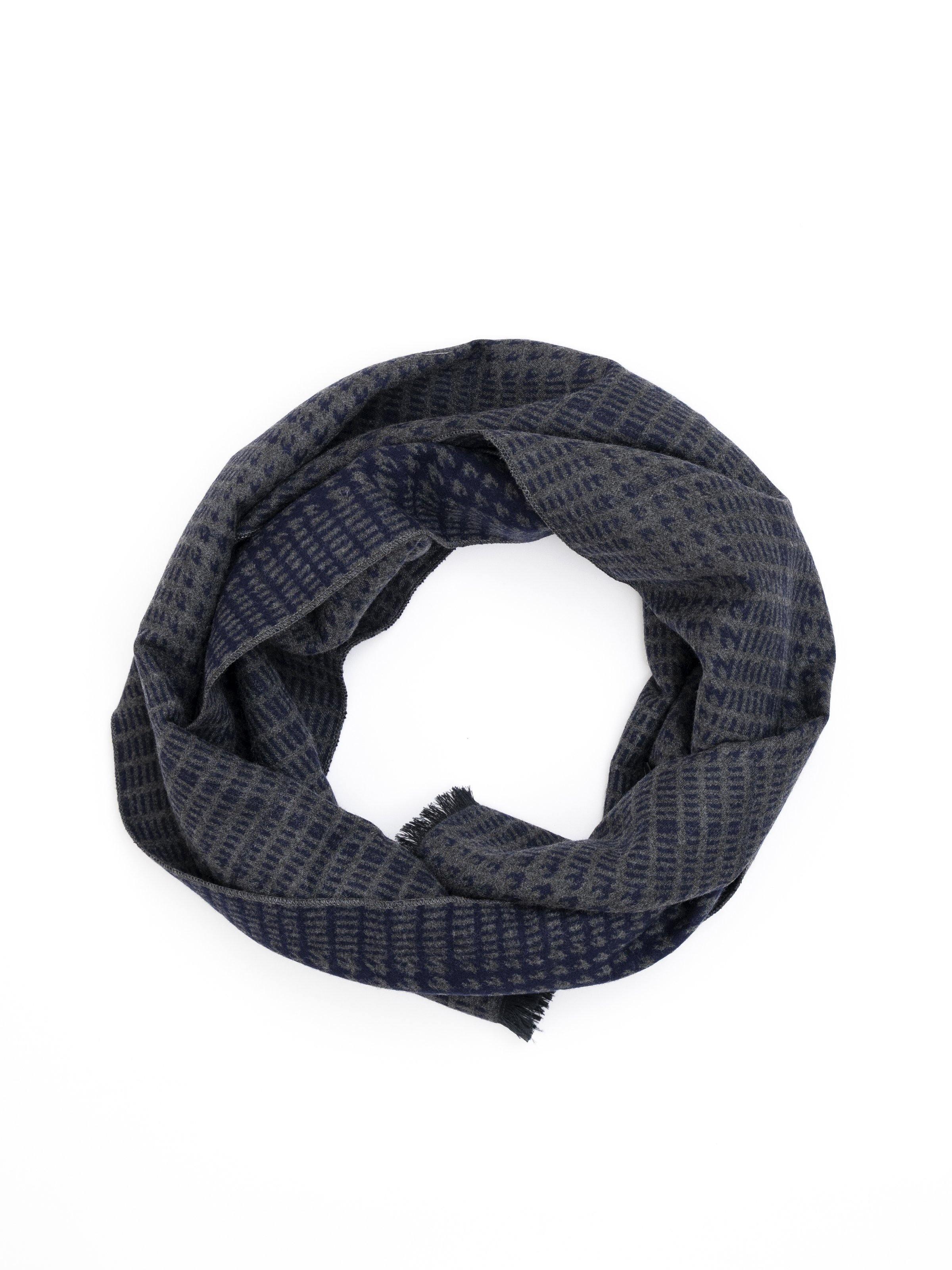 Dark navy woven scarf with small geometric pattern, looped for view