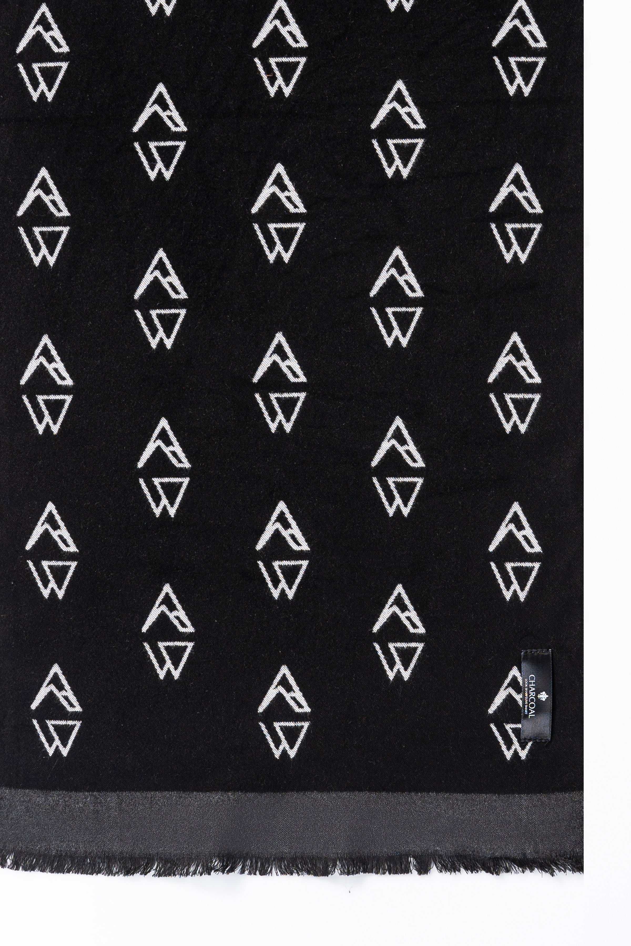 Black scarf fabric with repeating white geometric symbols pattern
