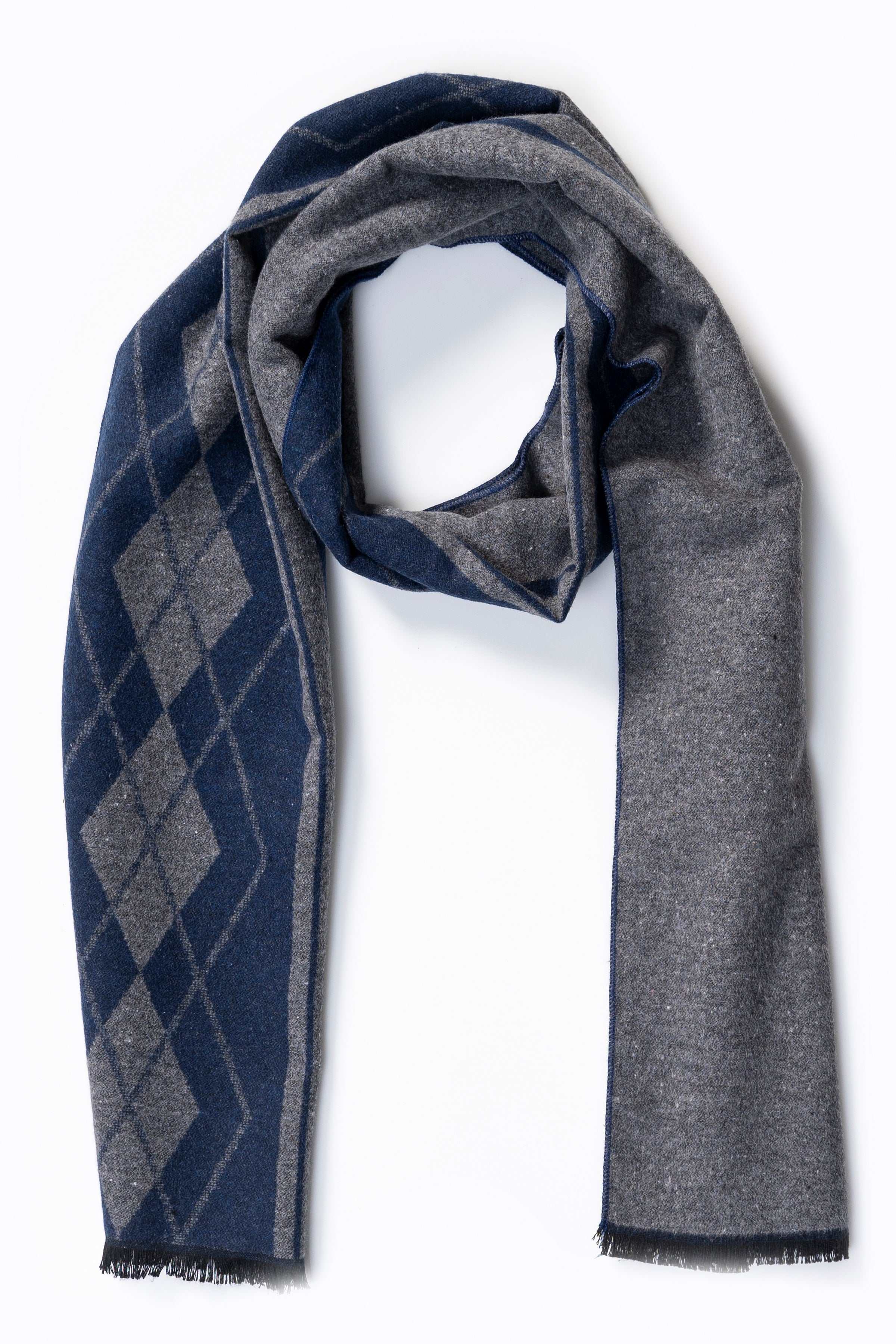 Two-tone scarf with dark-gray solid half and navy argyle diamond half, fringed edges