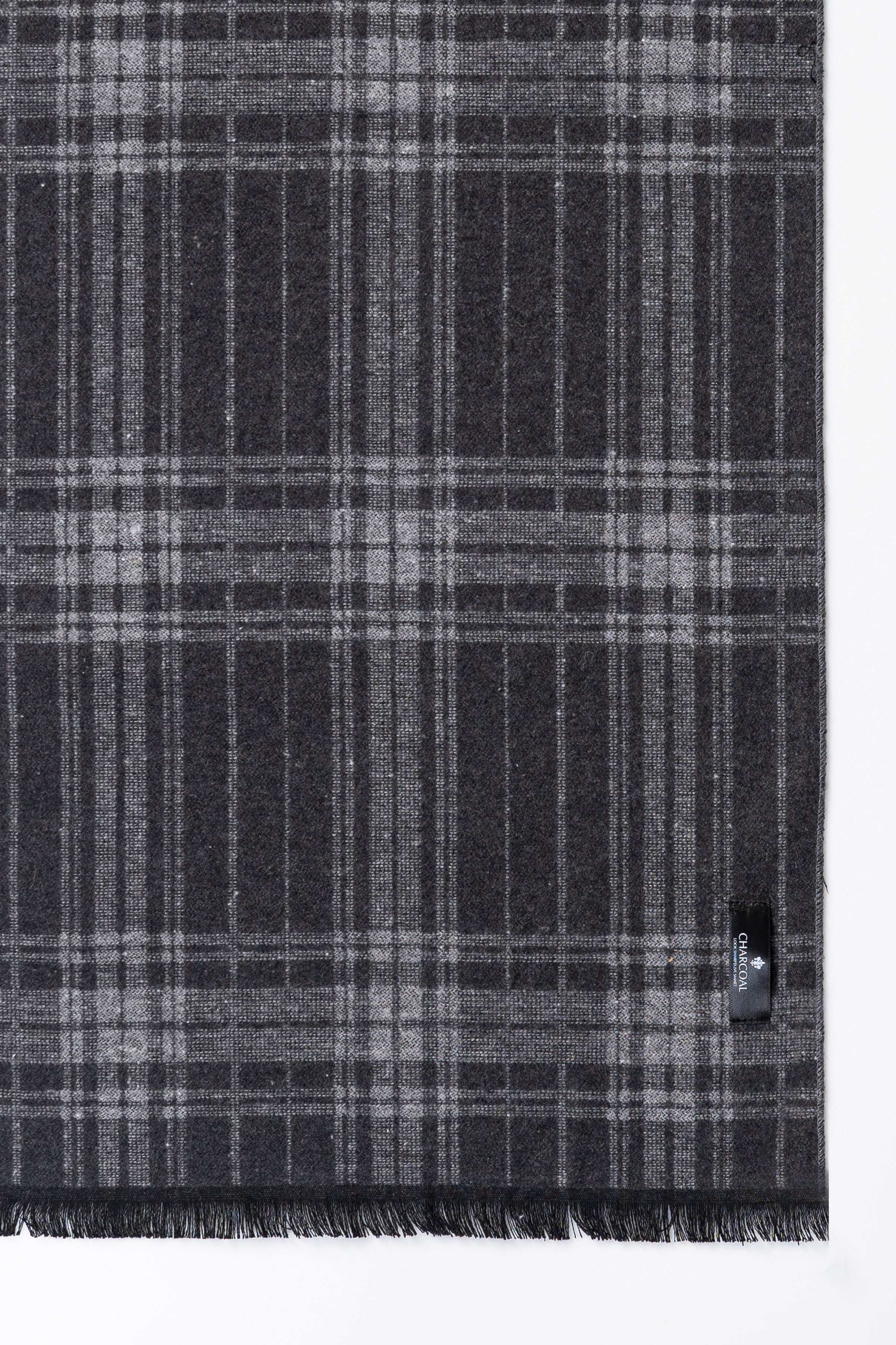 Dark gray plaid scarf with fringed ends and woven texture