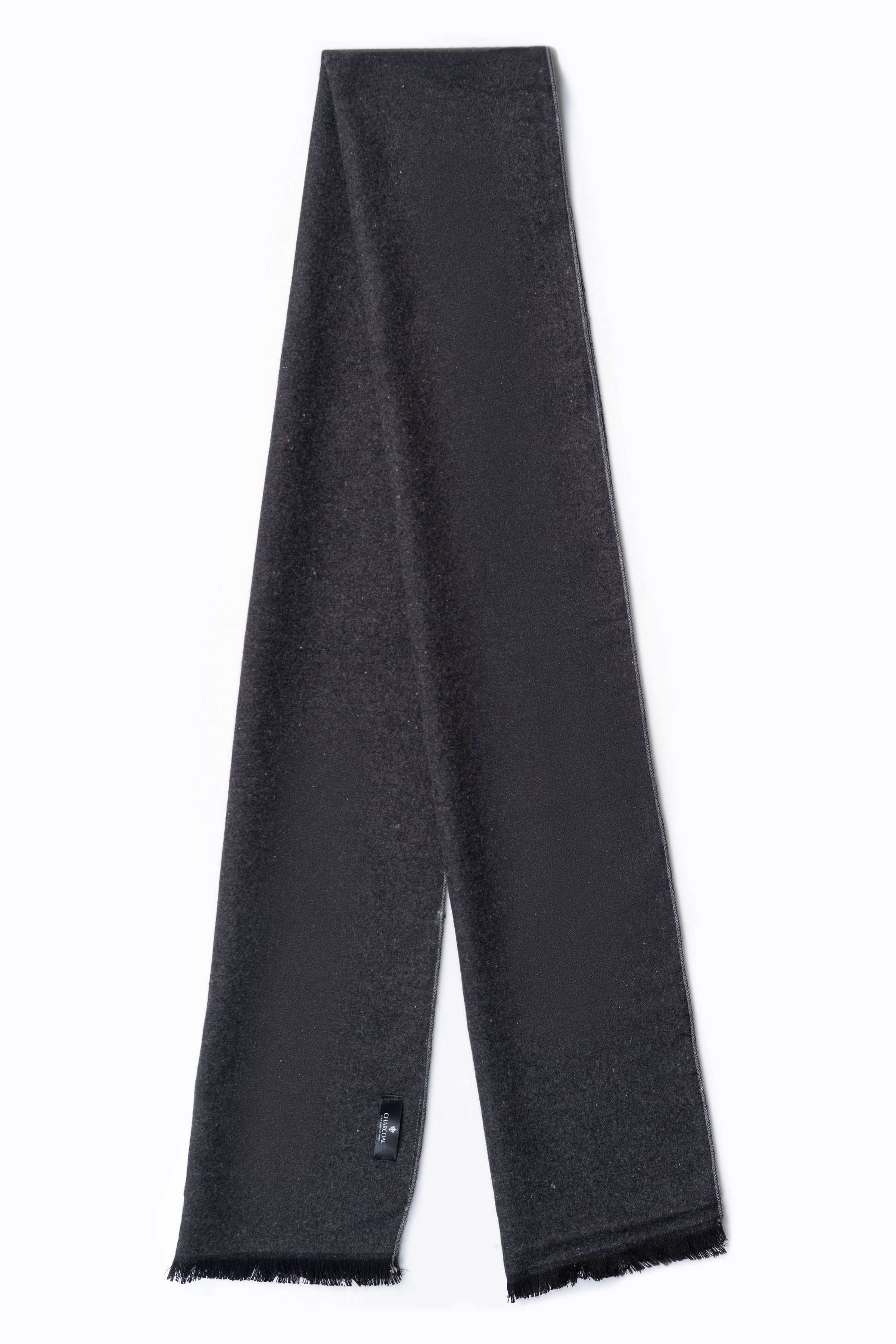 Scarf in dark shade with fringed ends and small front tab