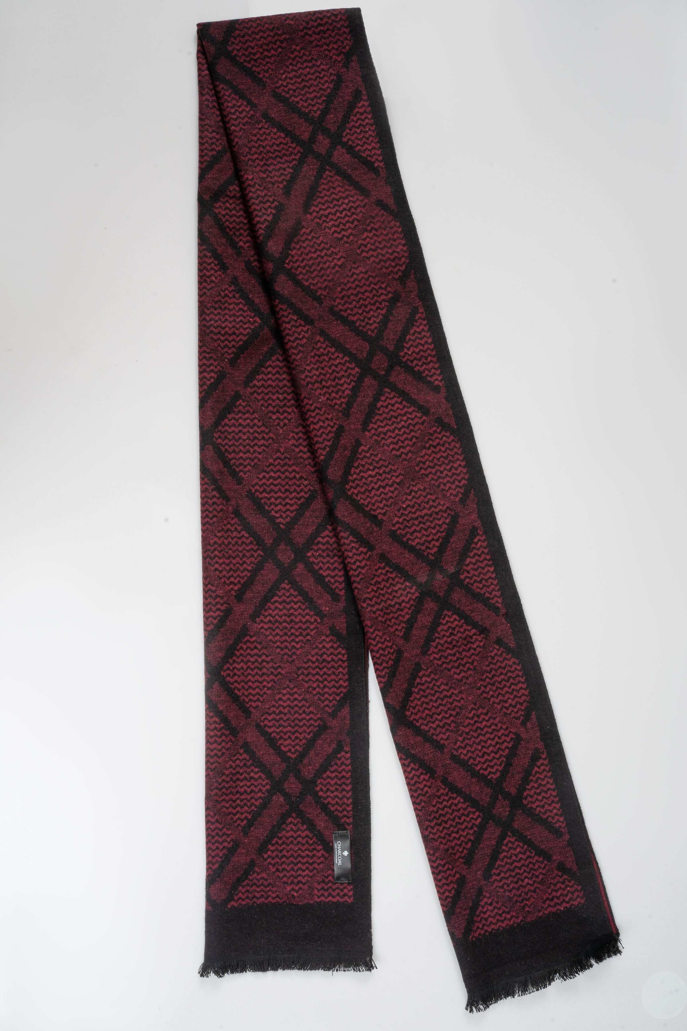 Burgundy long scarf with black lattice pattern and fringed ends; small tag