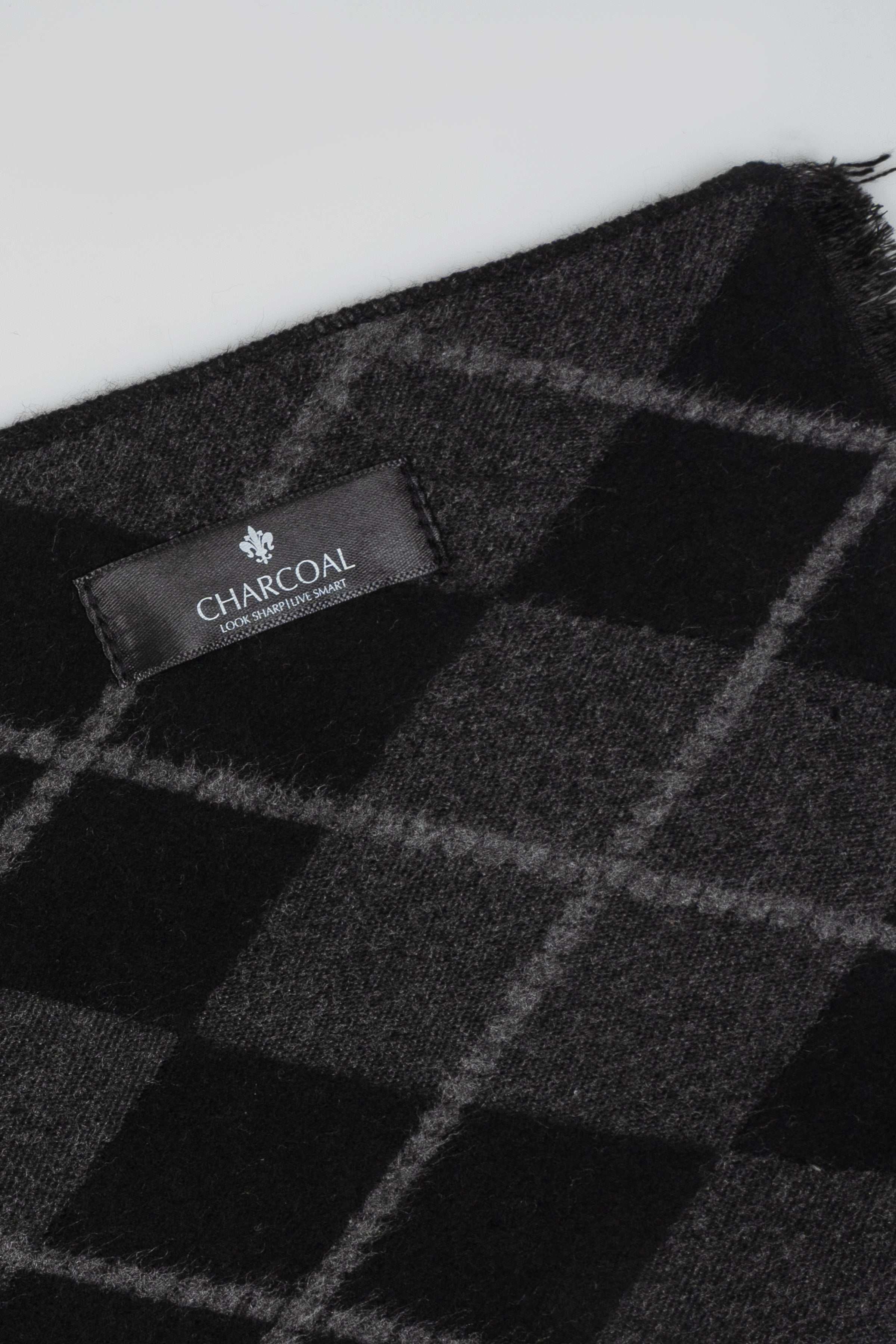 Charcoal plaid scarf detail with stitched logo label