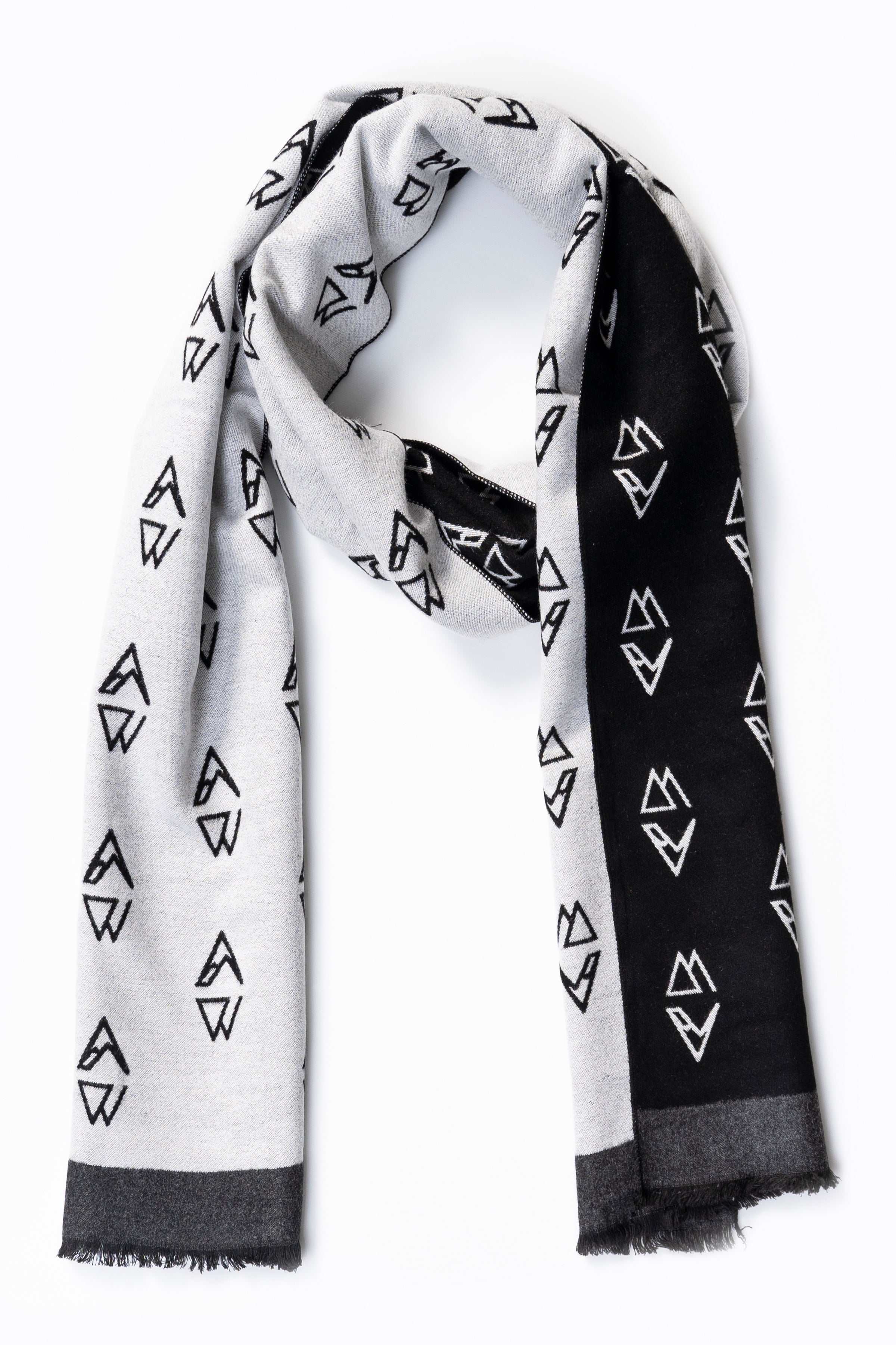 Two-tone scarf with white and black geometric symbols pattern and fringed ends