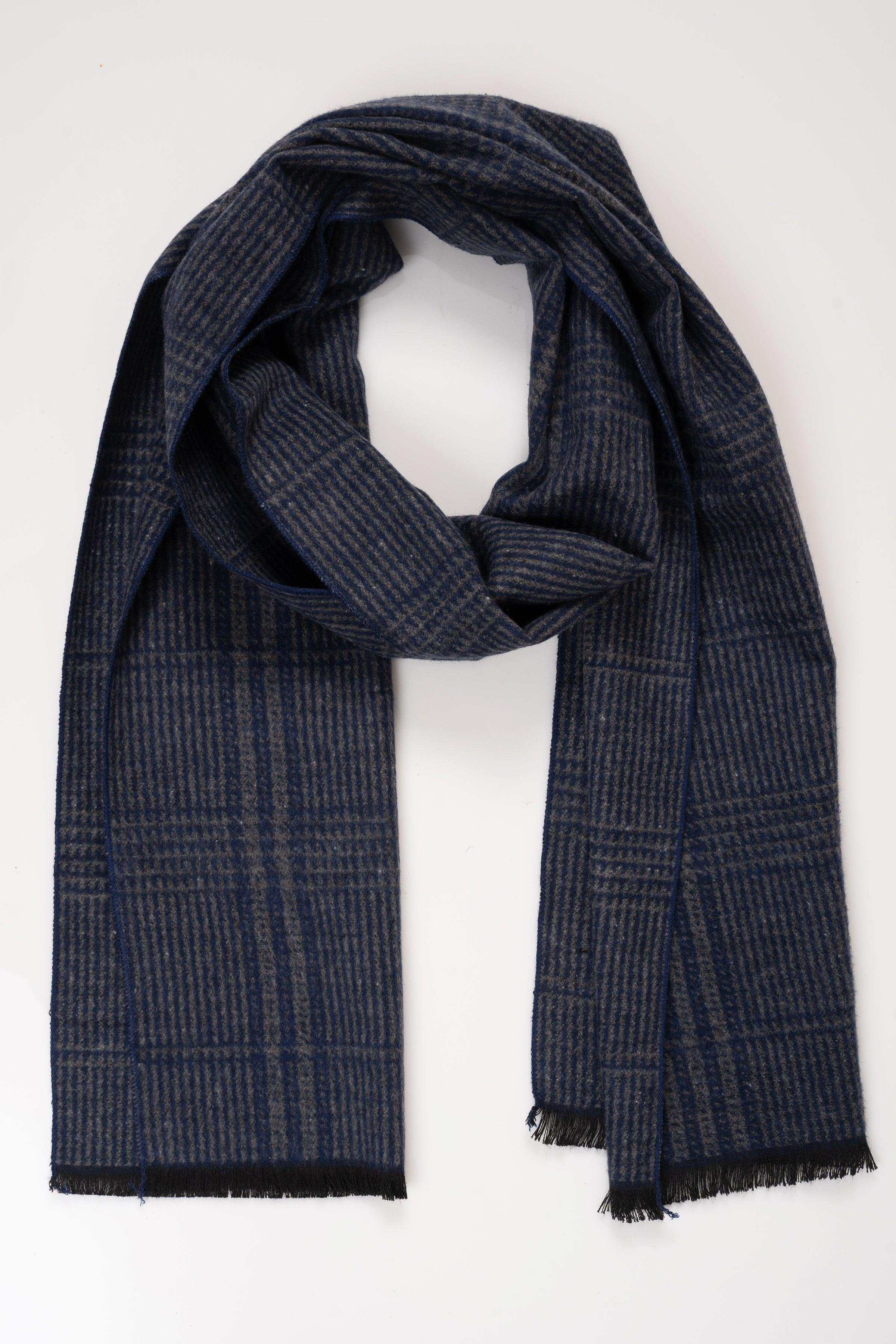 Dark plaid scarf with fringed ends, draped fold