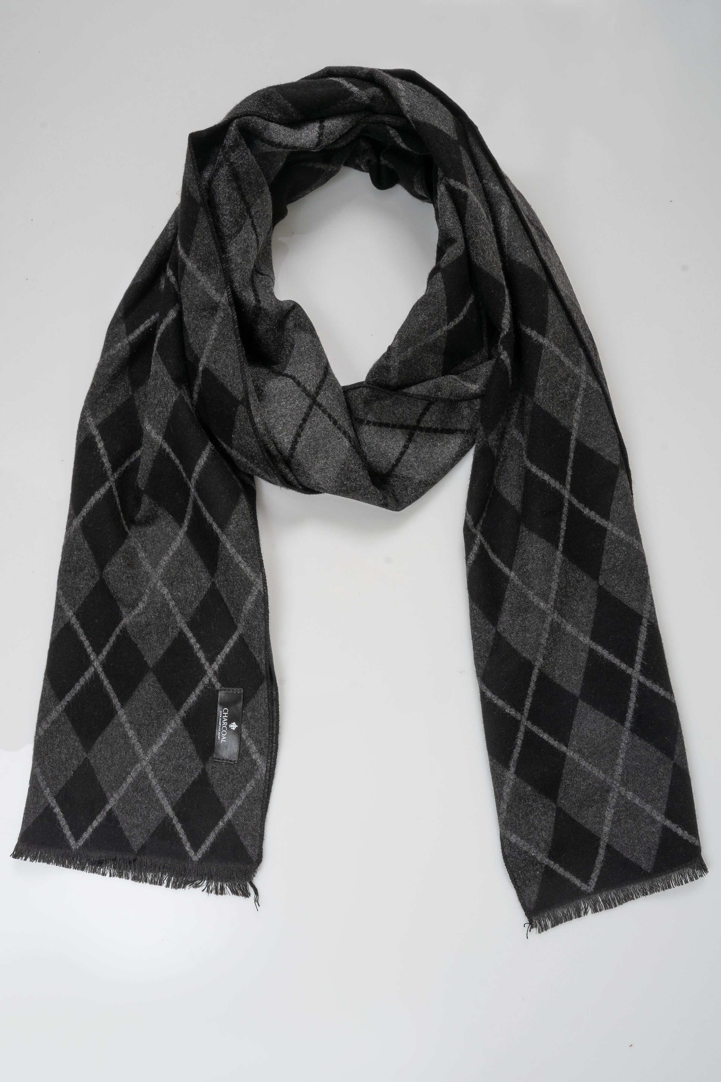 Charcoal diamond-check scarf looped around the neck, fringed ends visible