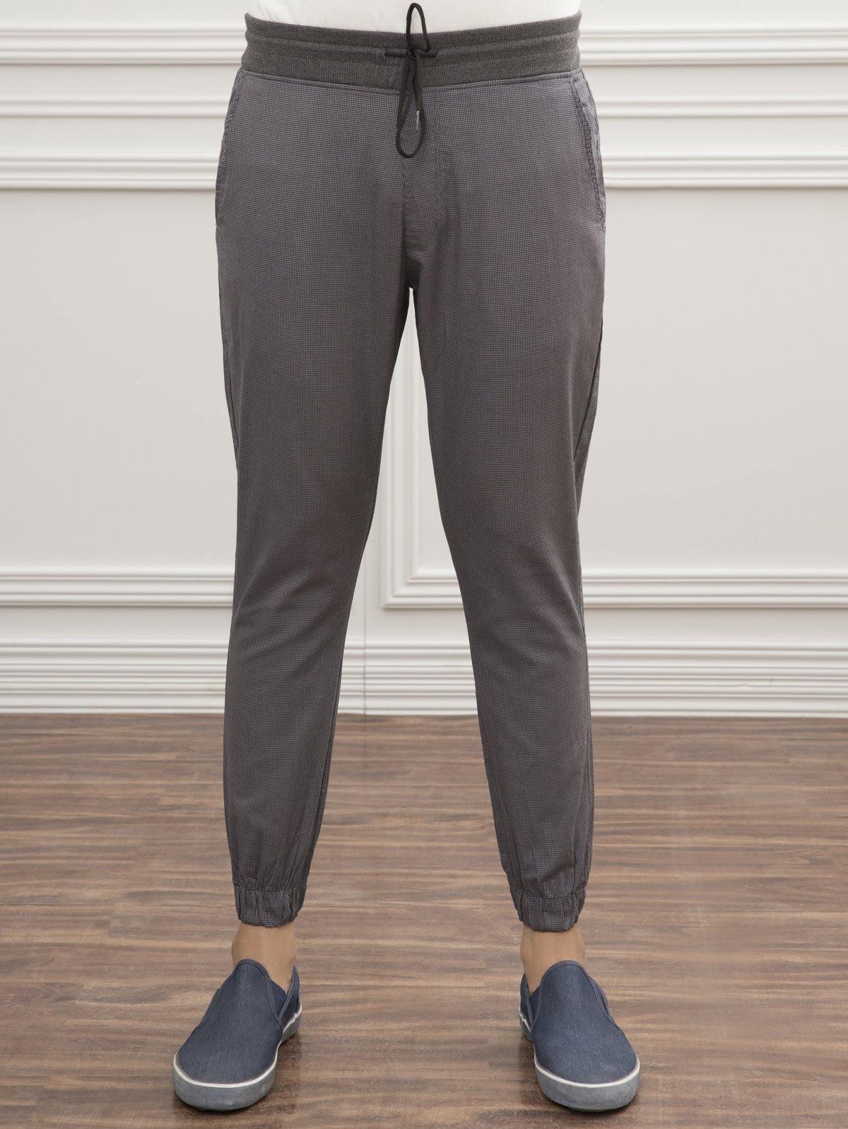 Grey slim-fit trousers with drawstring waist and elastic cuffs, full front view