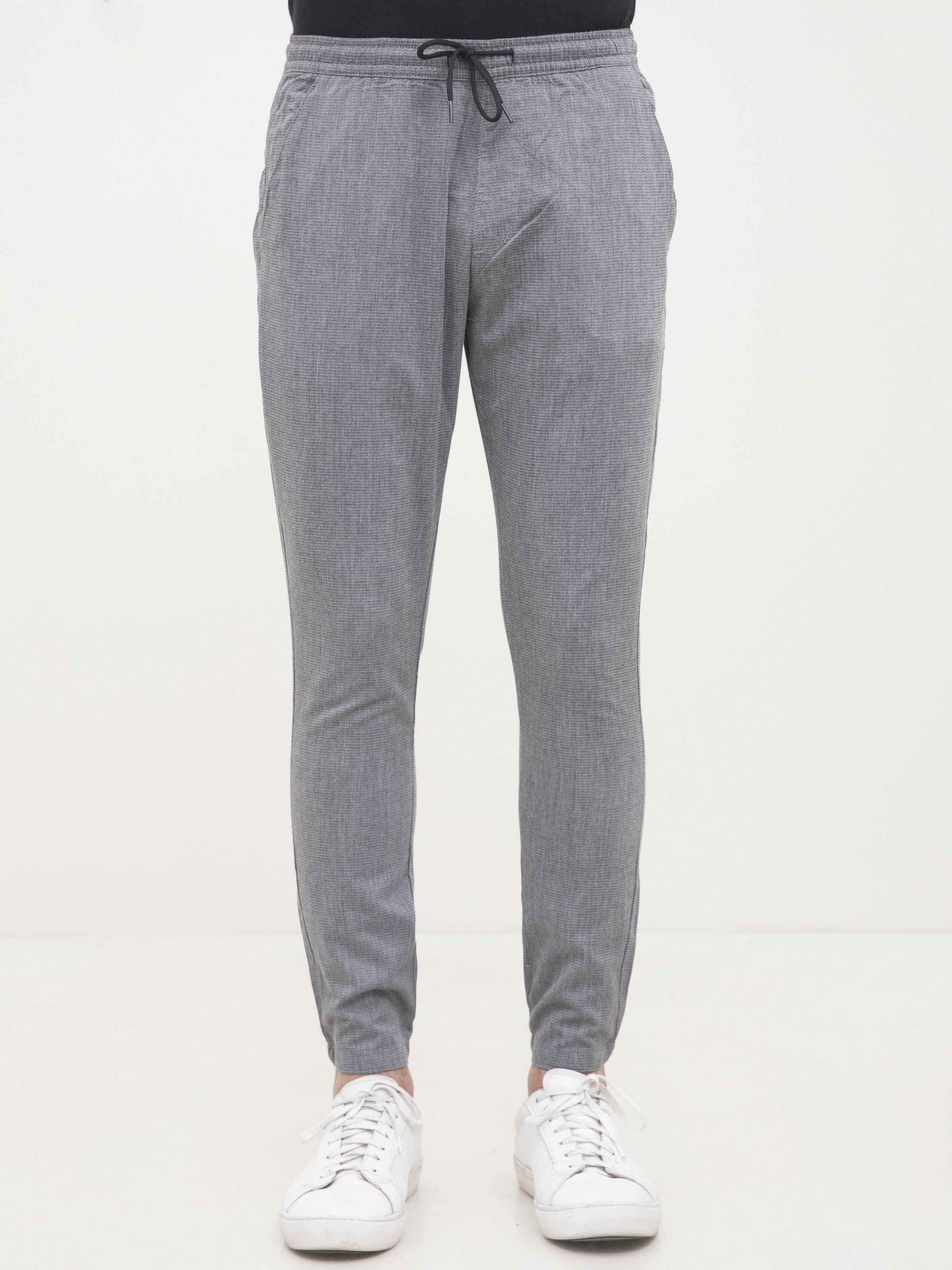 Light gray casual jogger trousers with drawstring waistband and ankle cuffs