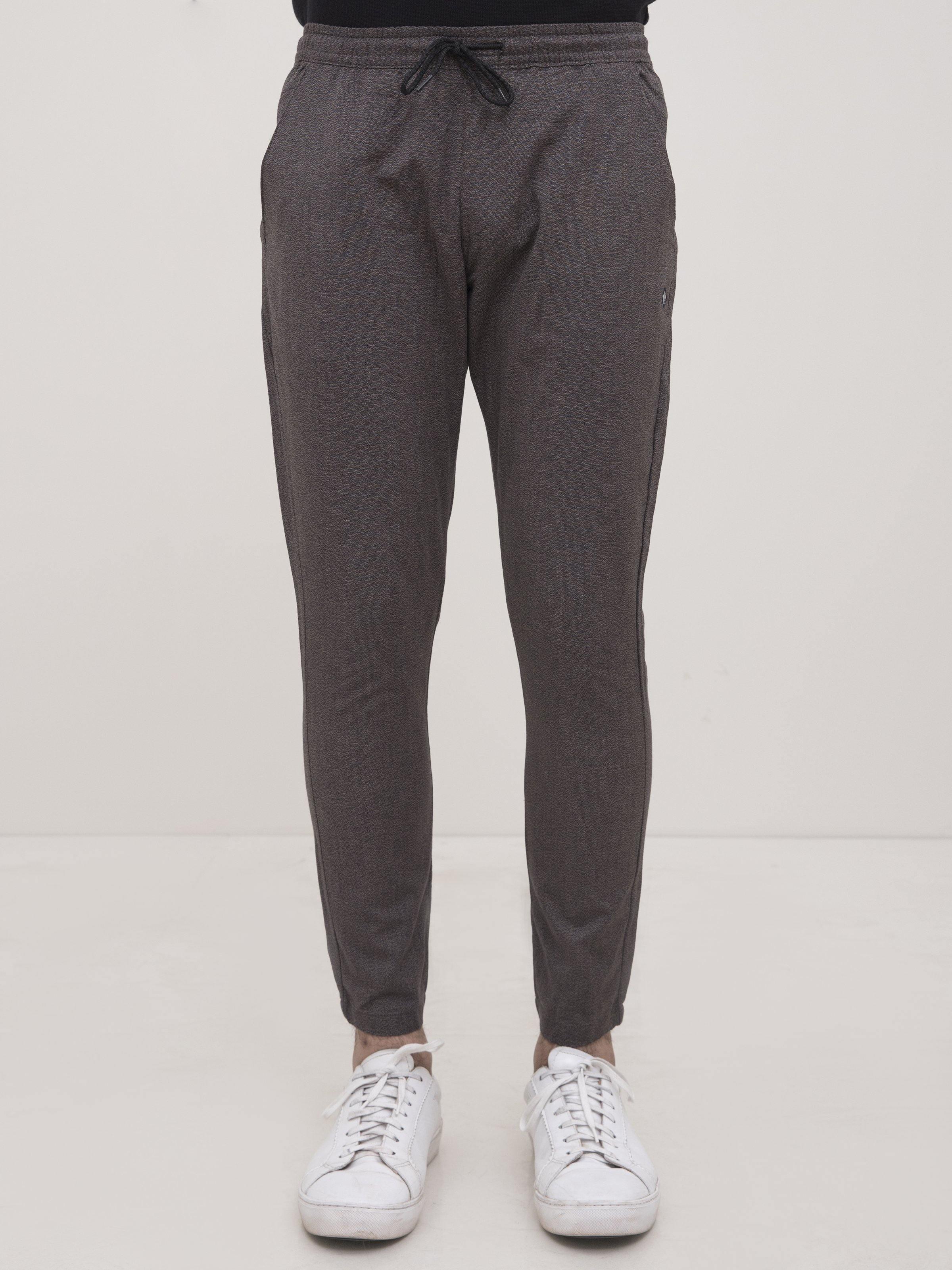 Dark gray tapered trousers, elastic waist with drawstring and side pockets