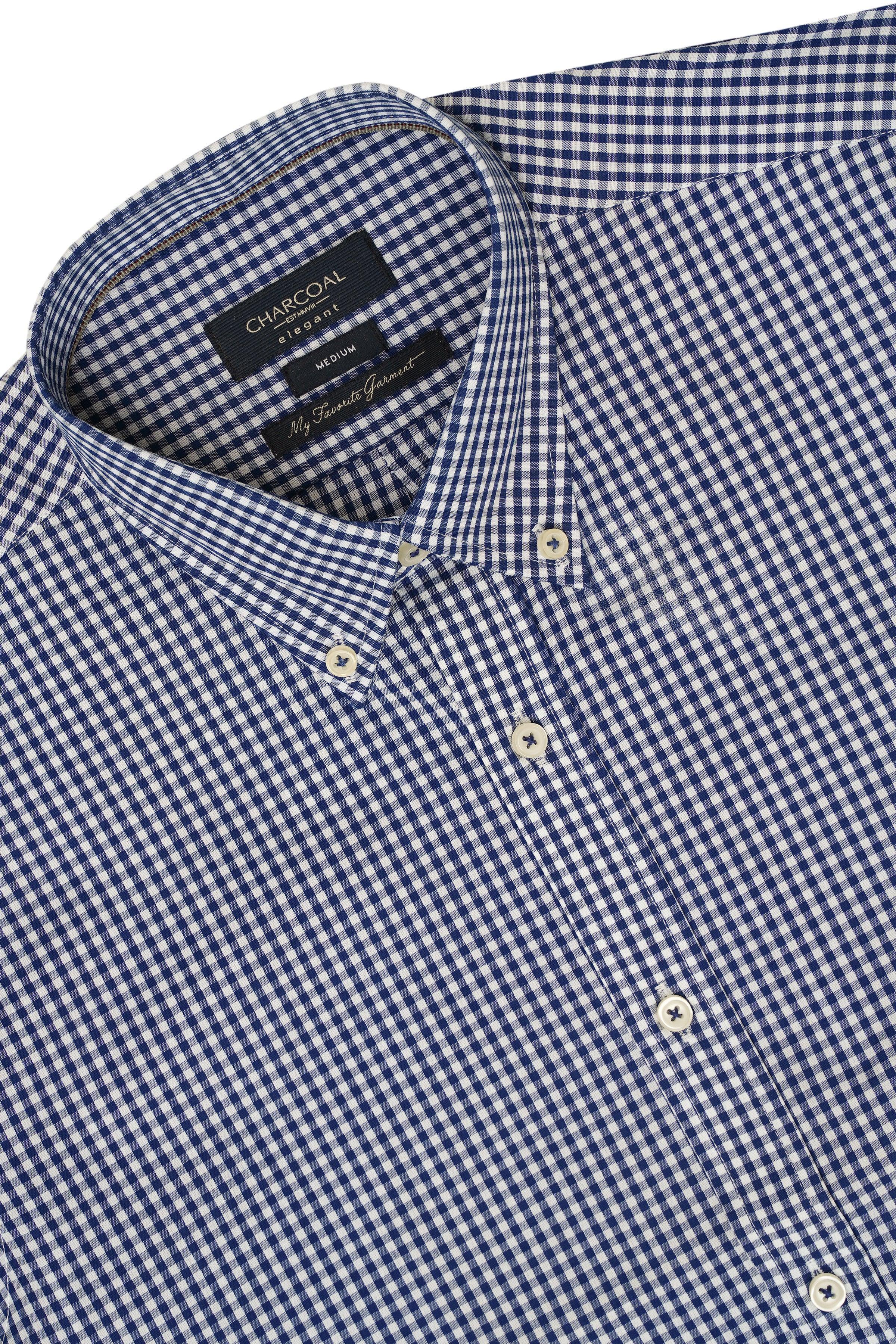 Navy and white check half-sleeve shirt detail with buttons and neck label
