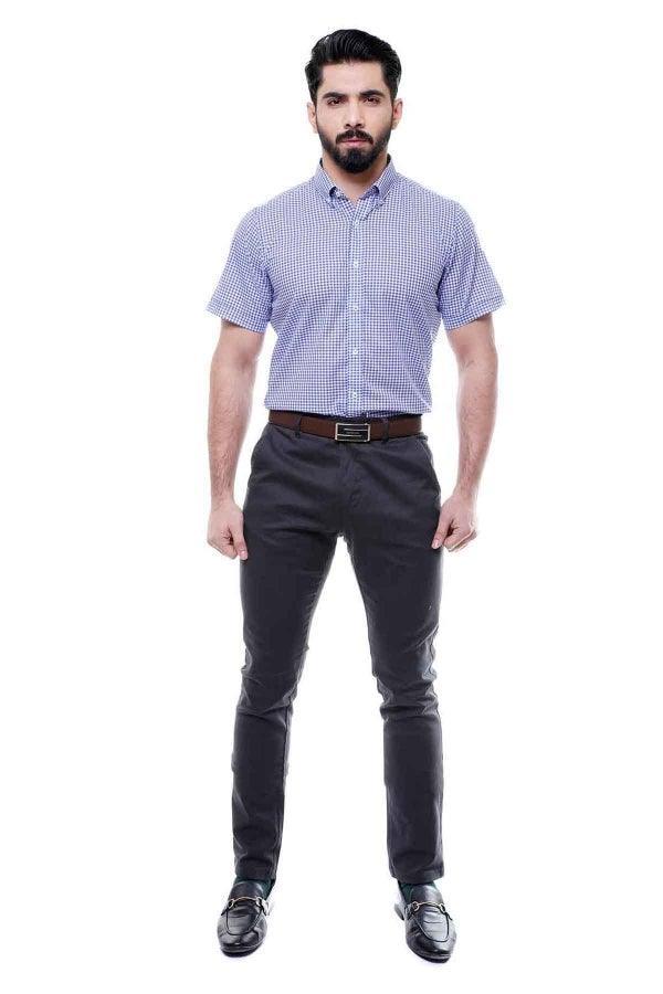Blue check half-sleeve button-down shirt with front buttons, worn with dark trousers