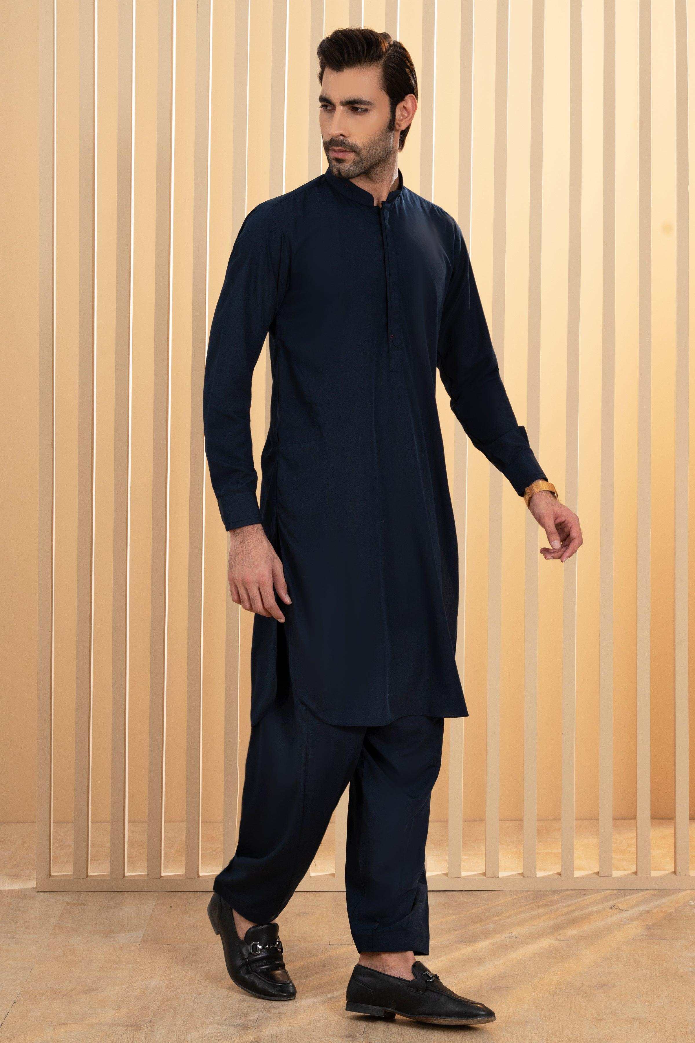 Navy shalwar kameez with long button-front kurta and cuffed trousers, standing pose
