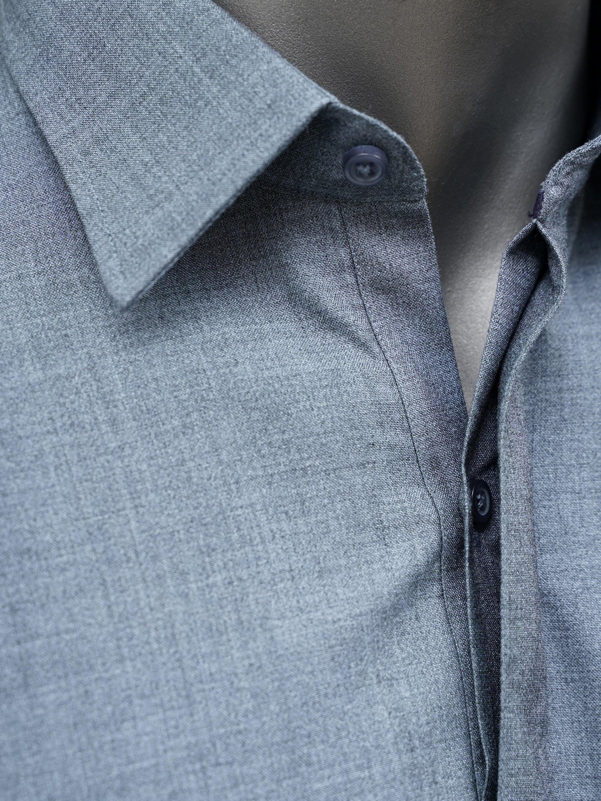 Light blue kameez fabric close-up with buttoned collar placket