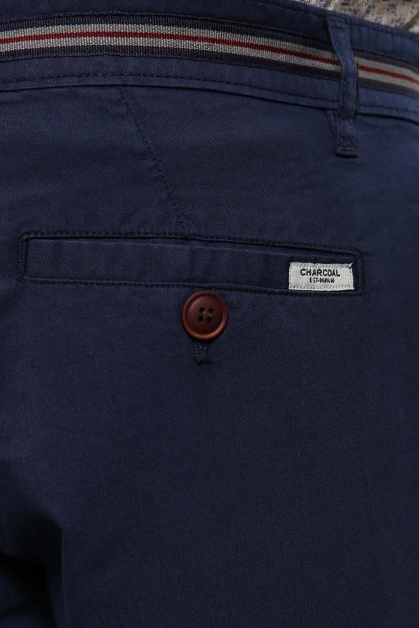 Navy chino shorts pocket with brown button and CHARCOAL logo label