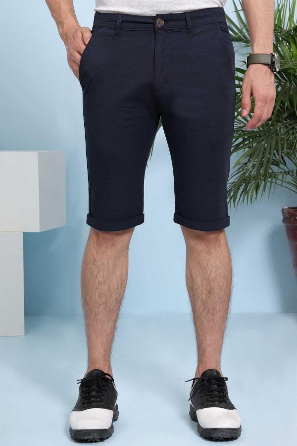 Navy chino-style shorts with cuffed hem, button closure, and front pockets