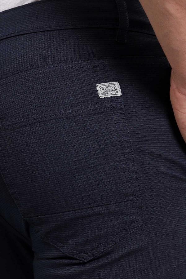 Navy shorts close-up with fabric texture and branded label on pocket