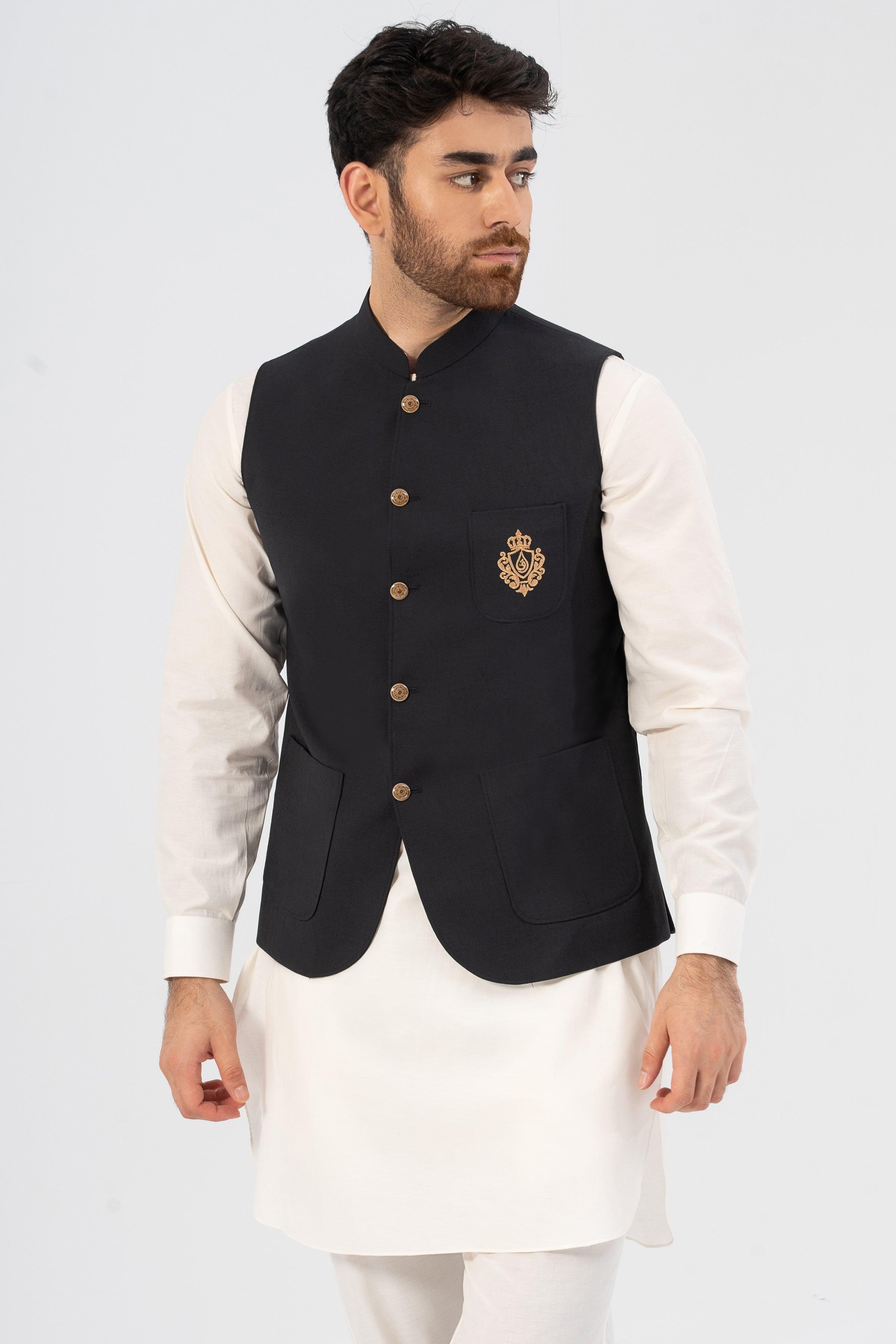 Black waistcoat with stand collar and gold button front, worn over white shirt