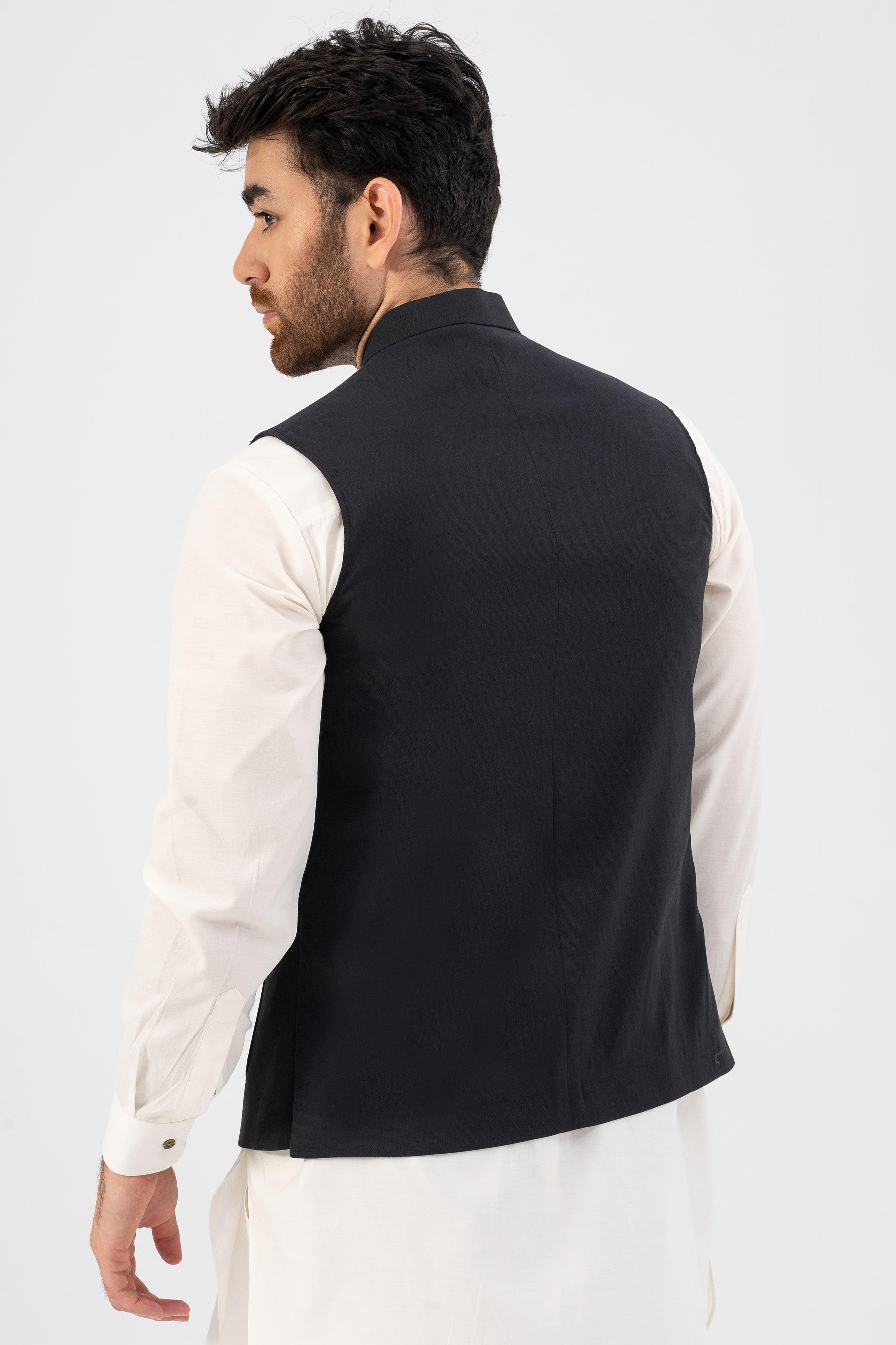 Black waistcoat back view, sleeveless with curved hem and side shaping