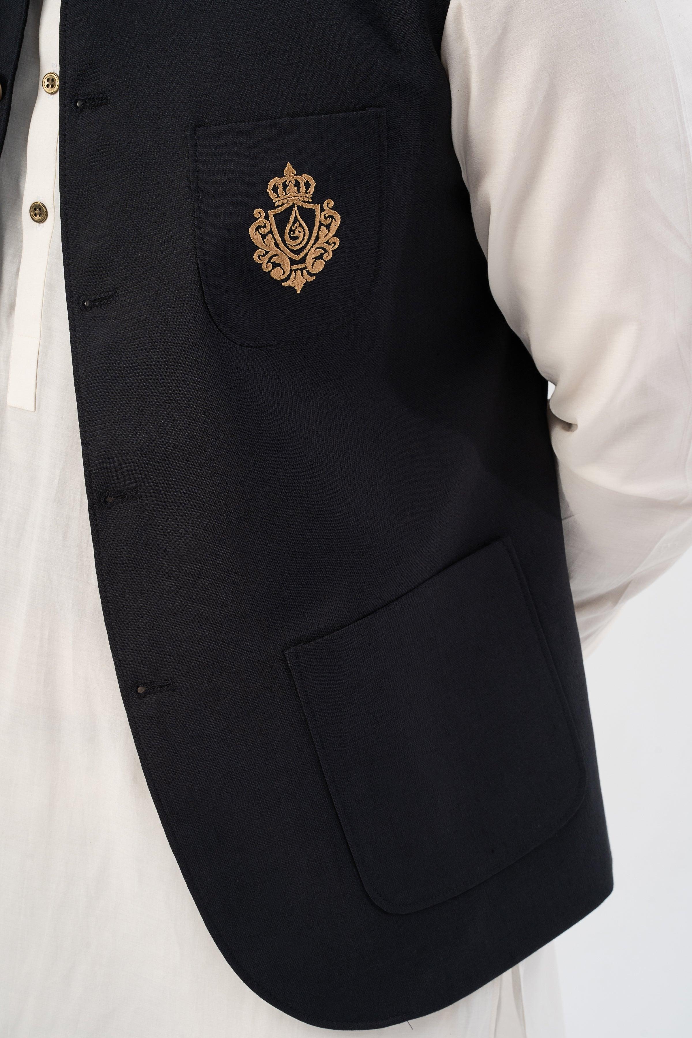 Black waistcoat chest pocket with gold embroidered crest and gold button