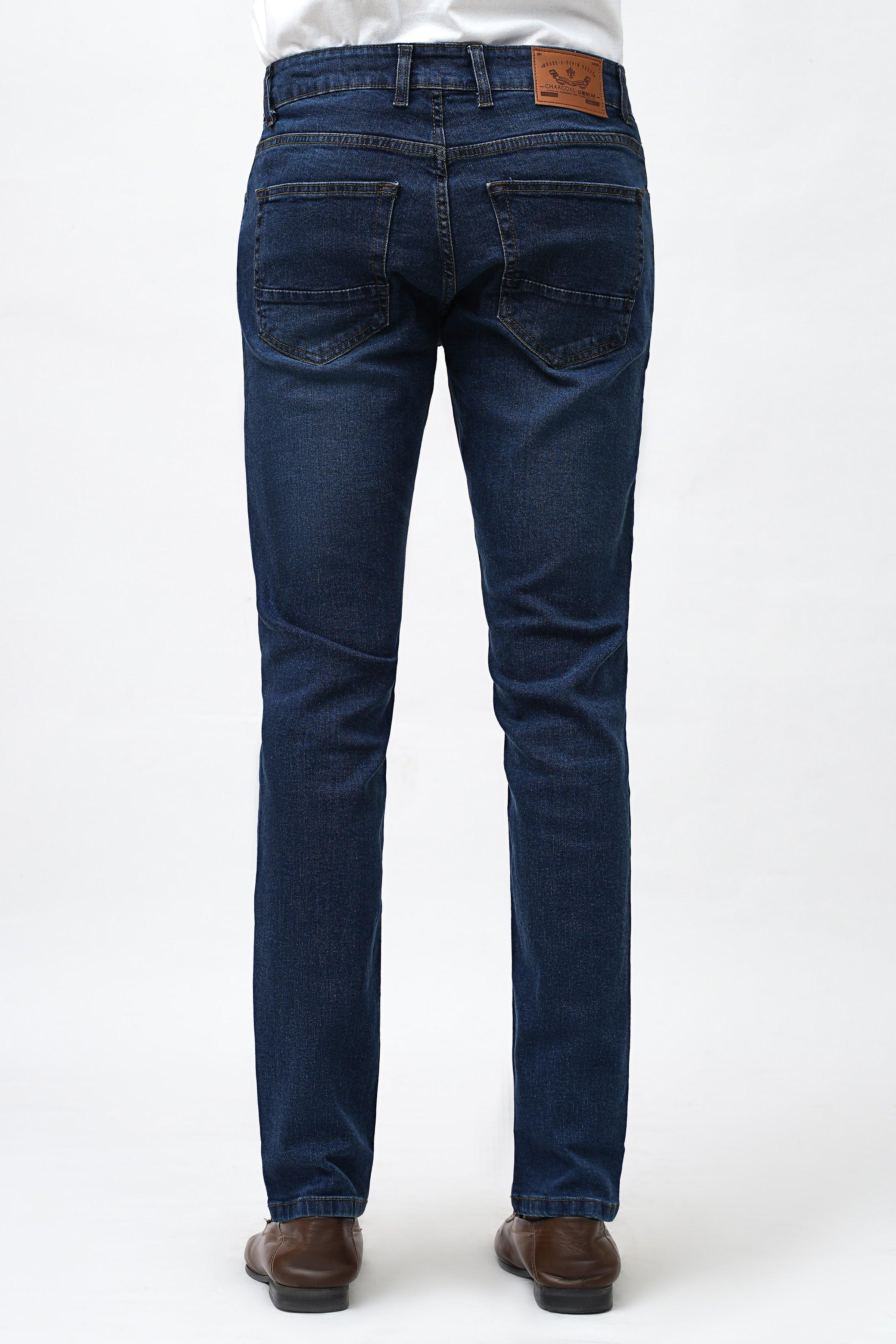 Dark blue skinny jeans back view with rear pockets and dark stitched seams