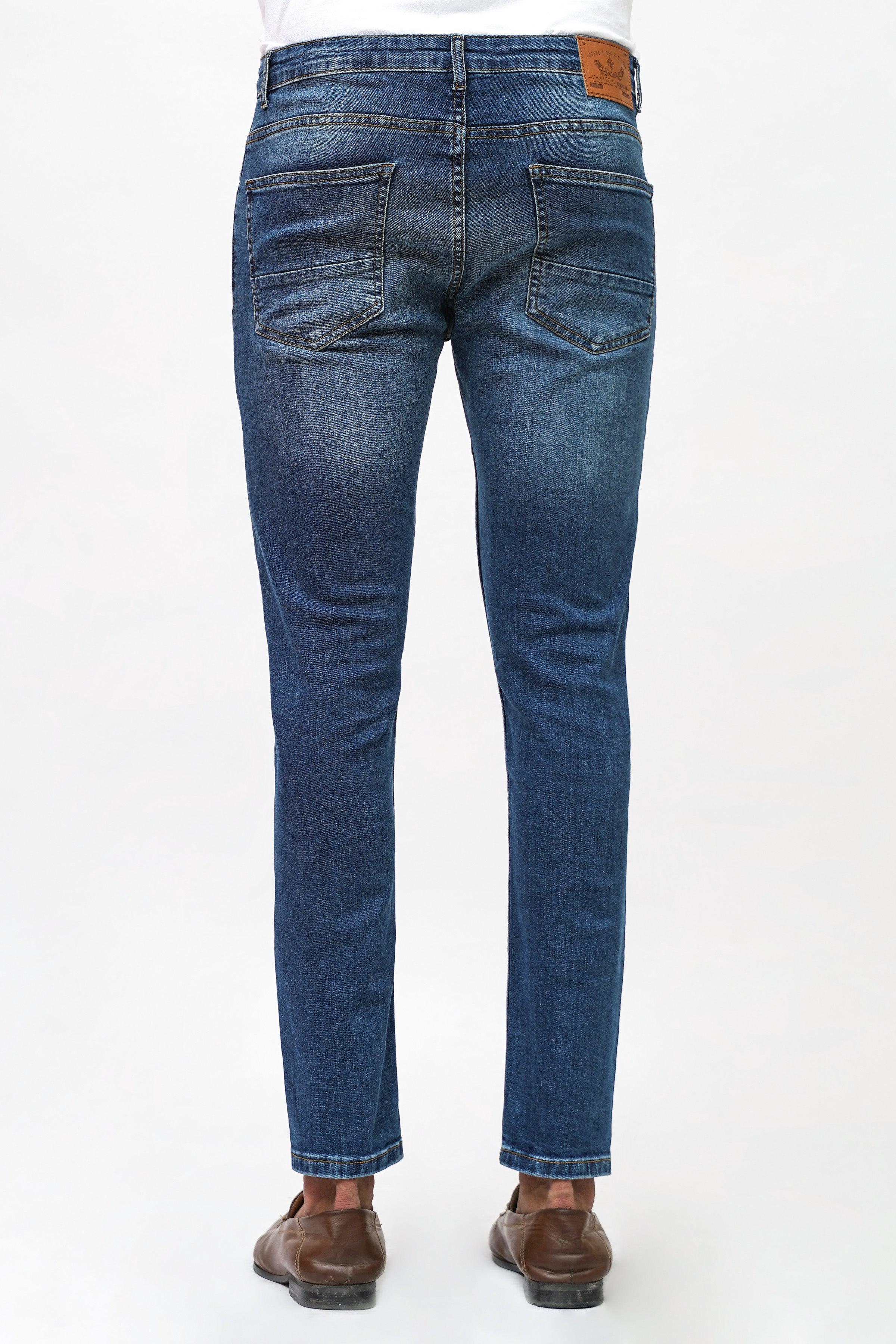 Mid blue skinny-fit denim jeans, back pockets, belt loops, slim tapered fit.