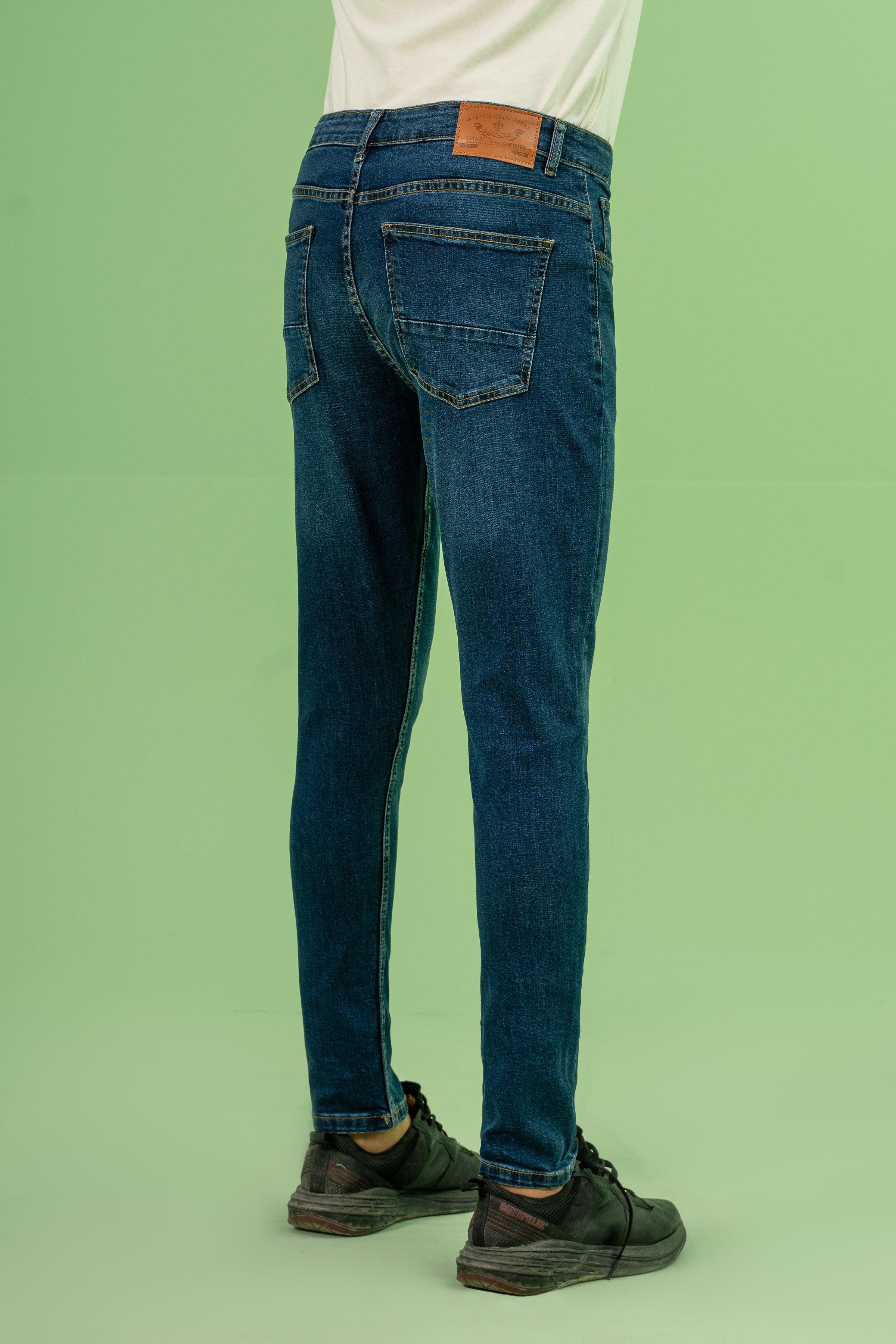 Dark blue skinny leg denim jeans, front view with front pockets and button fly
