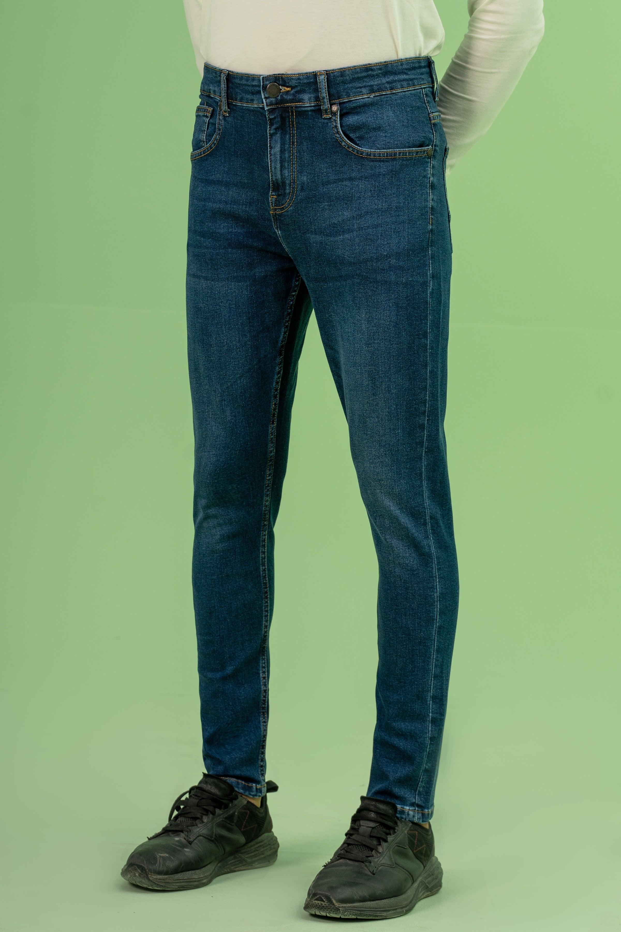 Dark blue skinny denim jeans, back view with rear pockets and belt loops