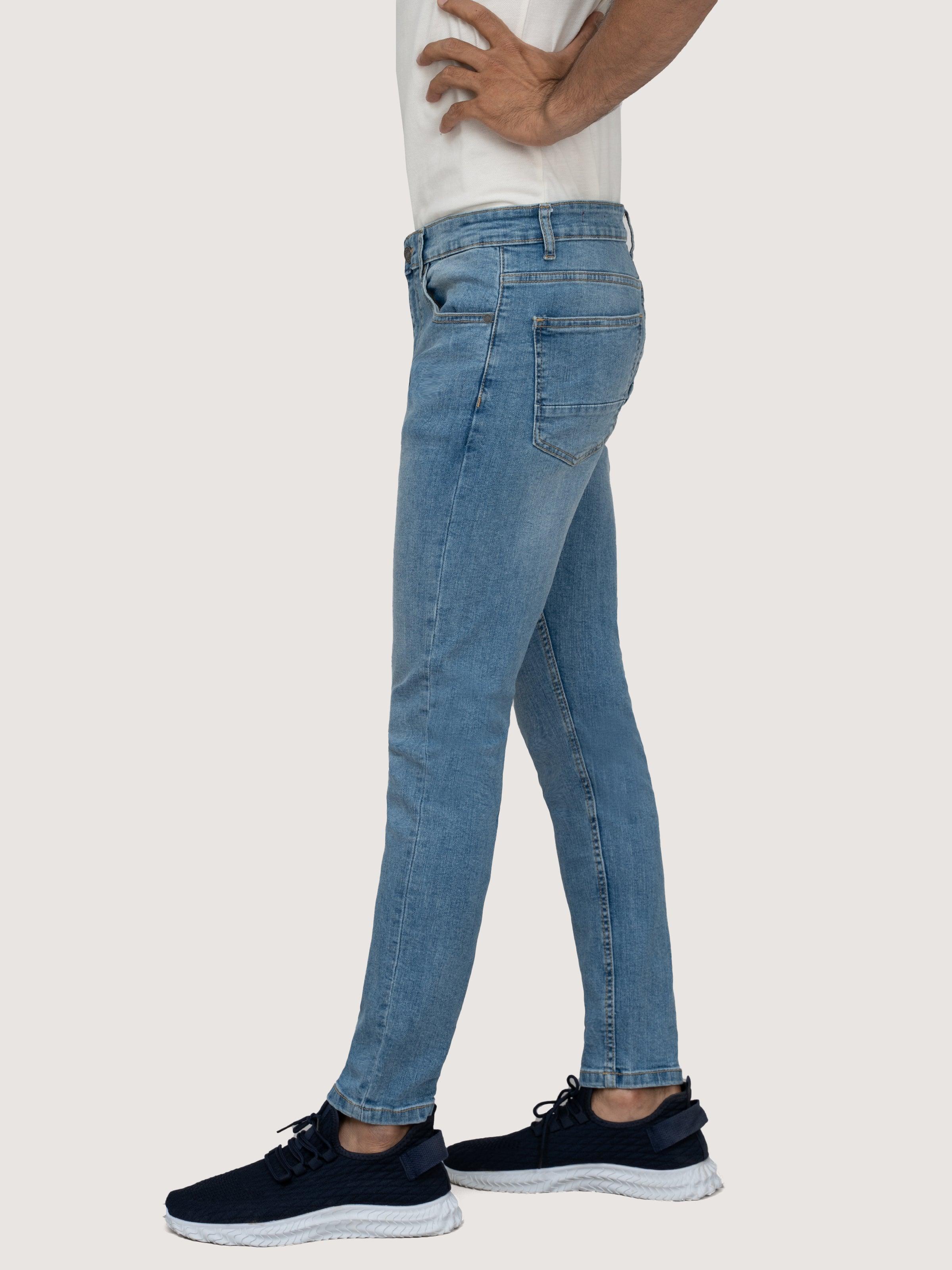 Light blue skinny-leg denim jeans, five-pocket design and zip fly