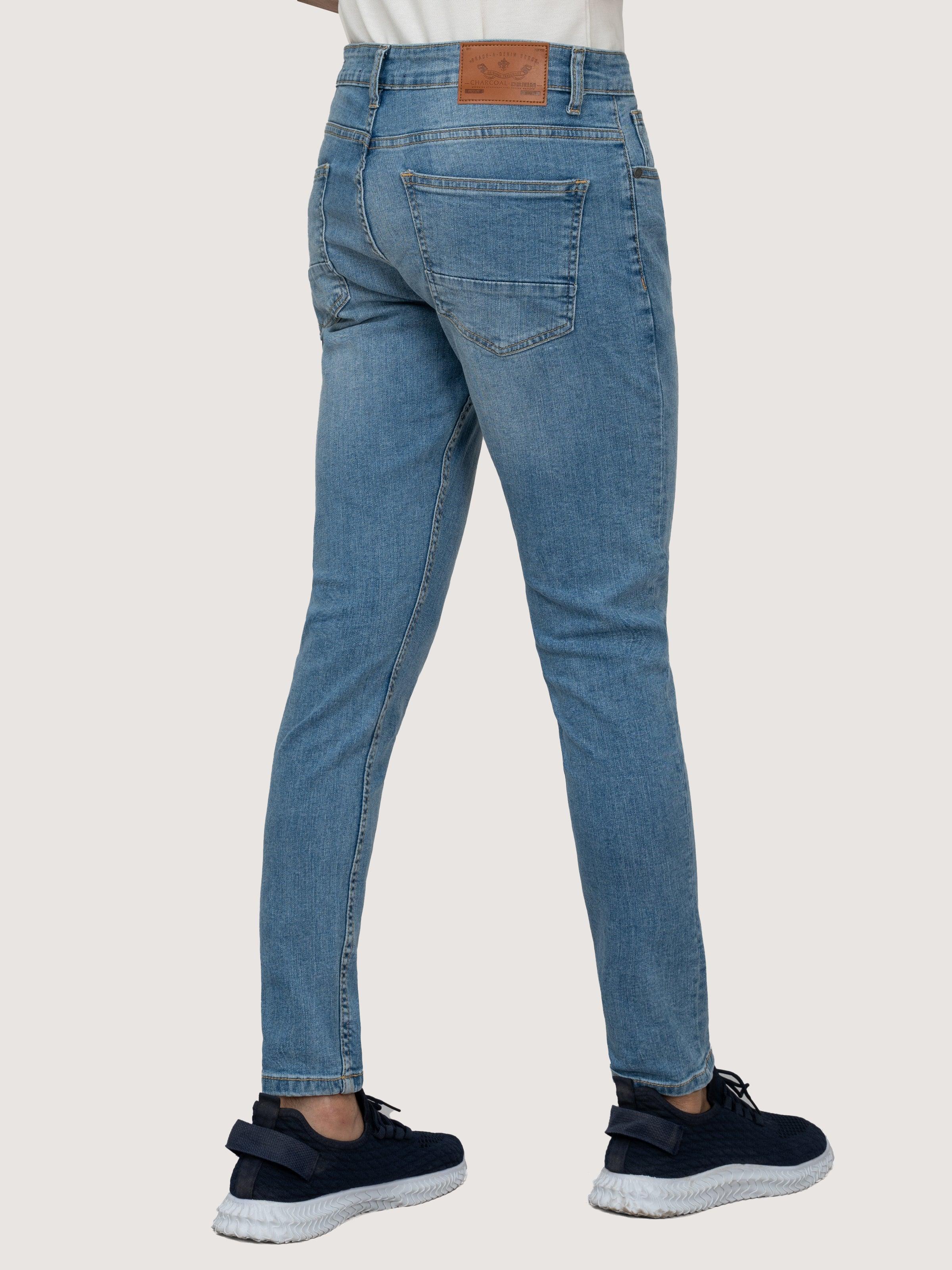 Light blue skinny-leg denim jeans with back yoke and patch pockets