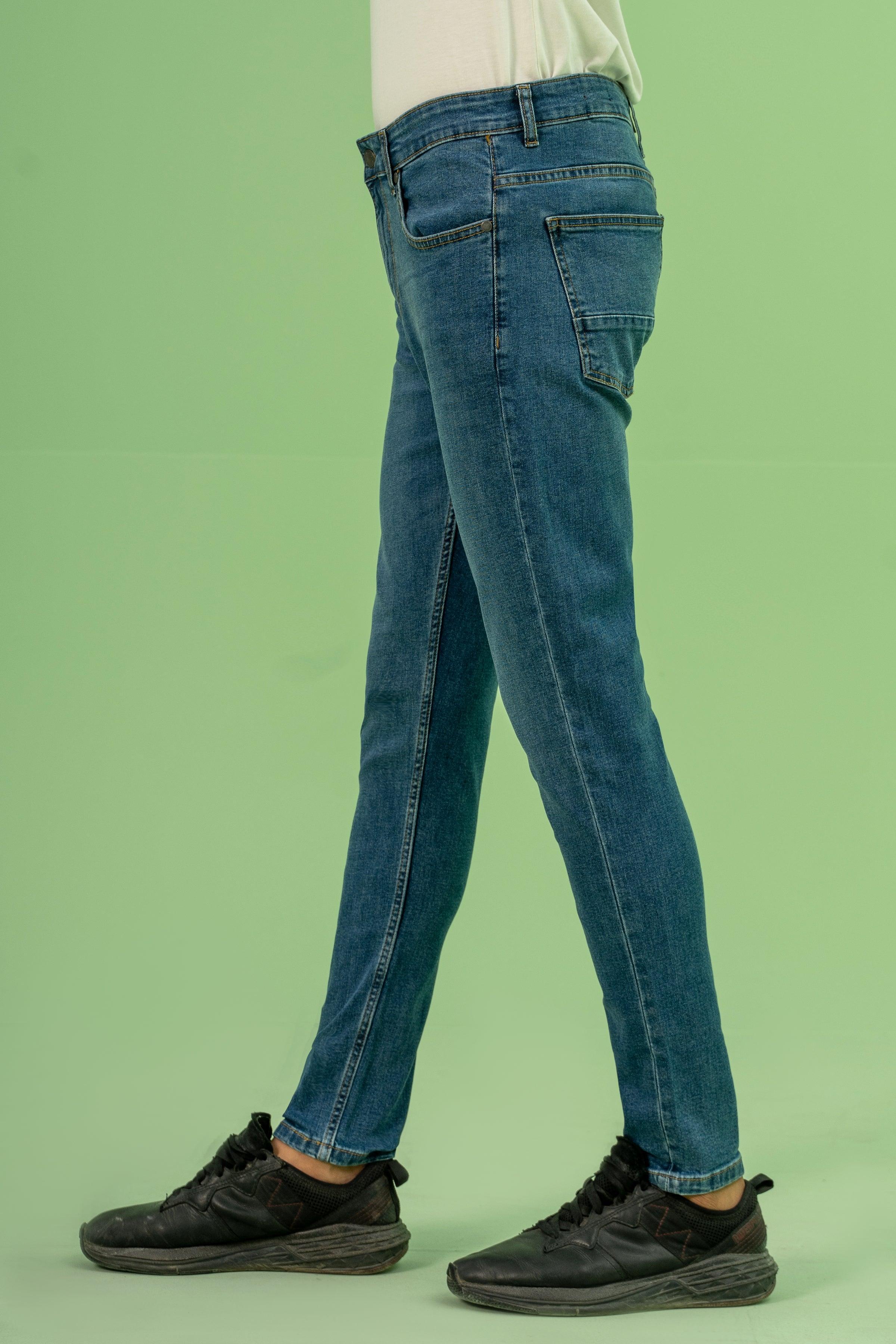 Mid-blue skinny-leg denim jeans with button fly, 5-pocket design