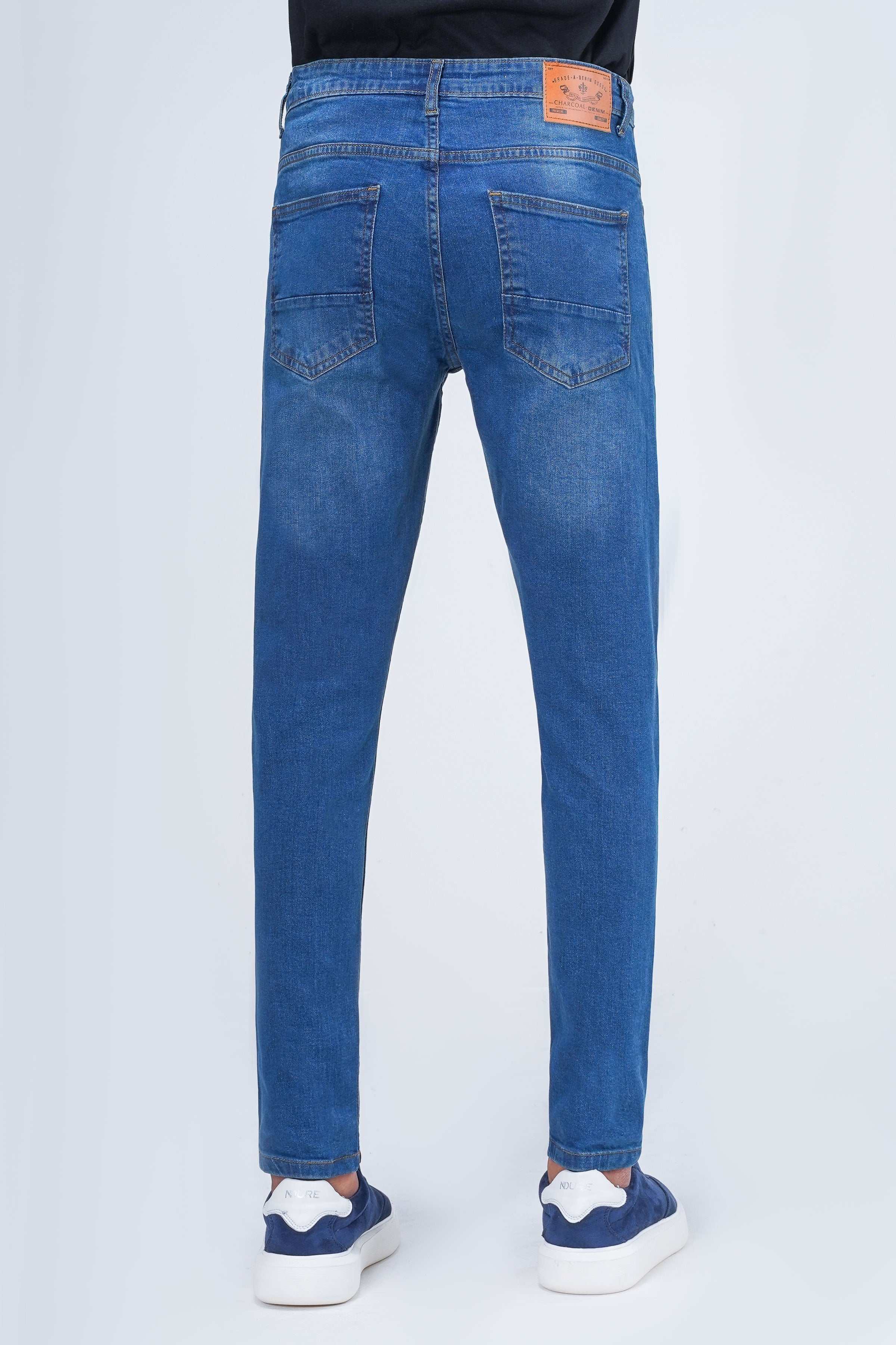 Mid-blue skinny-fit denim jeans with logo patch at waistband and rear pockets