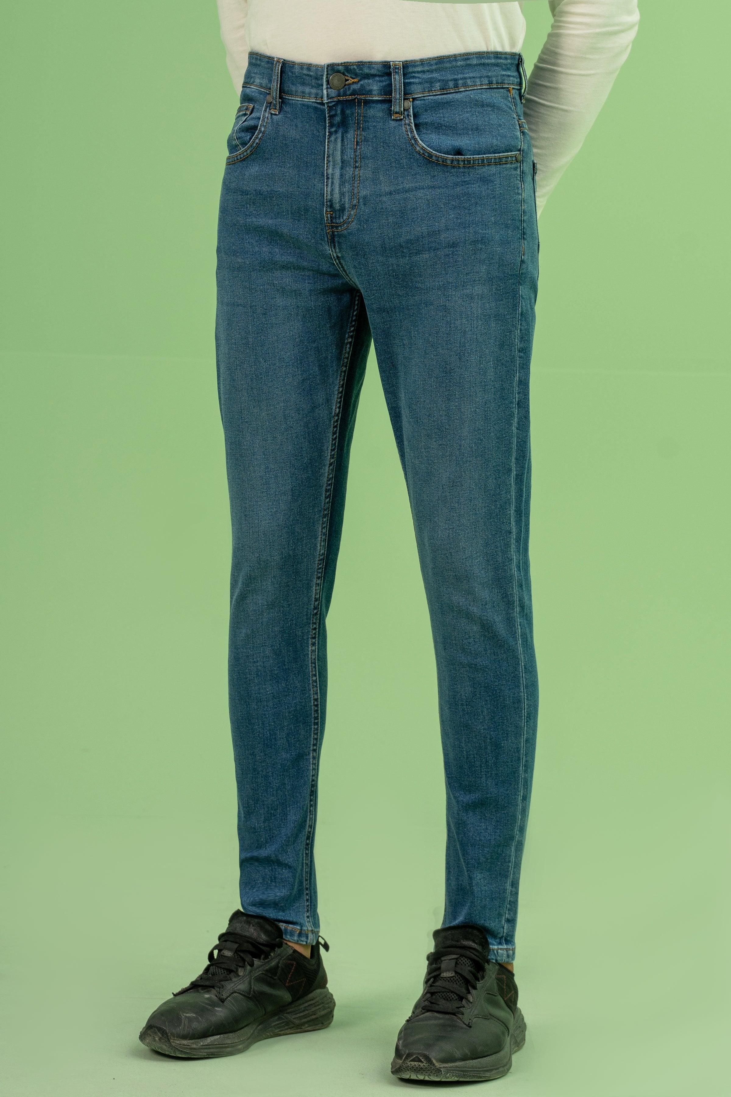 Mid-blue skinny-leg denim jeans, straight slim fit, belt loops, back view