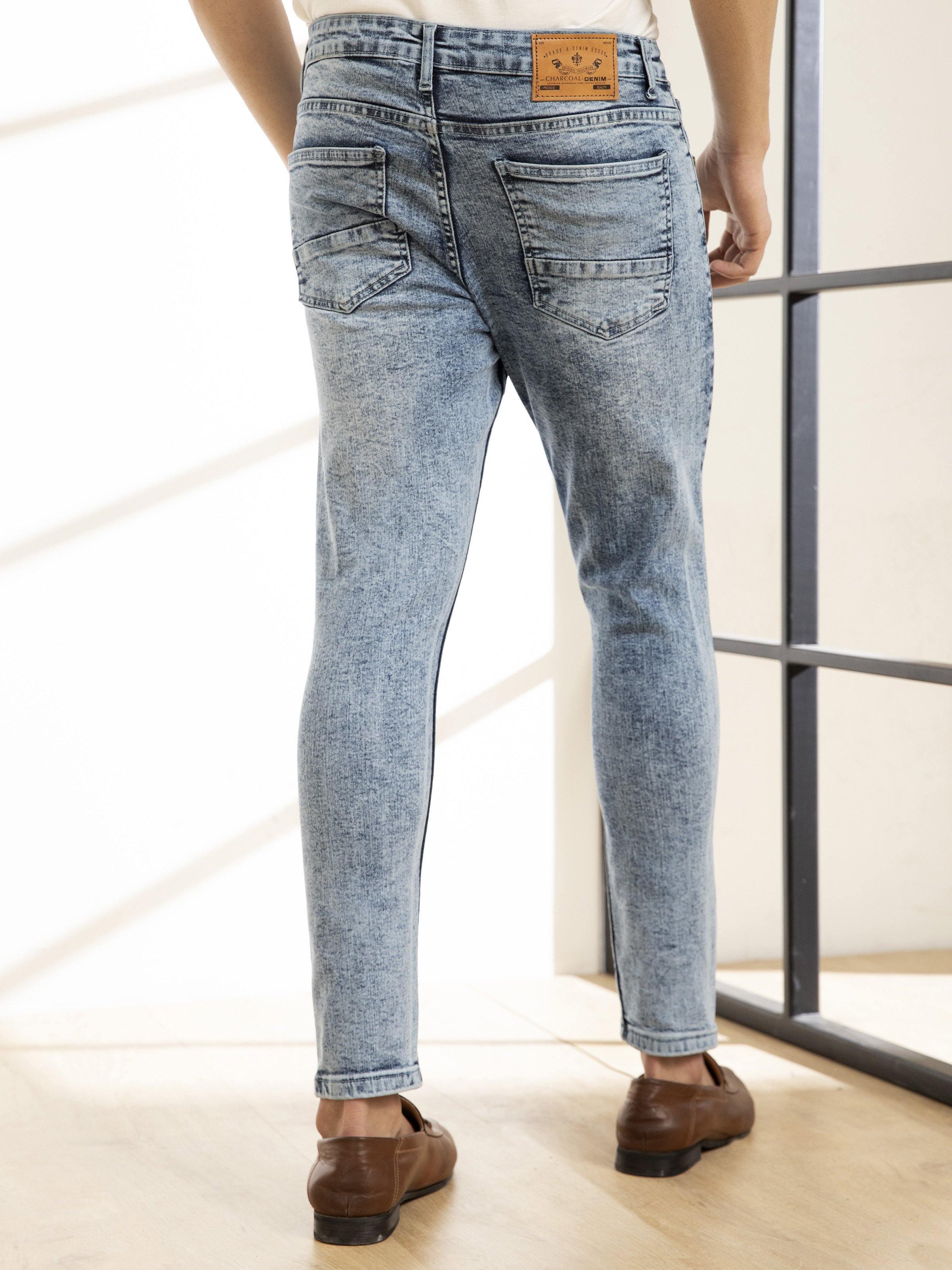 Light blue skinny jeans on-model, back view with two back pockets