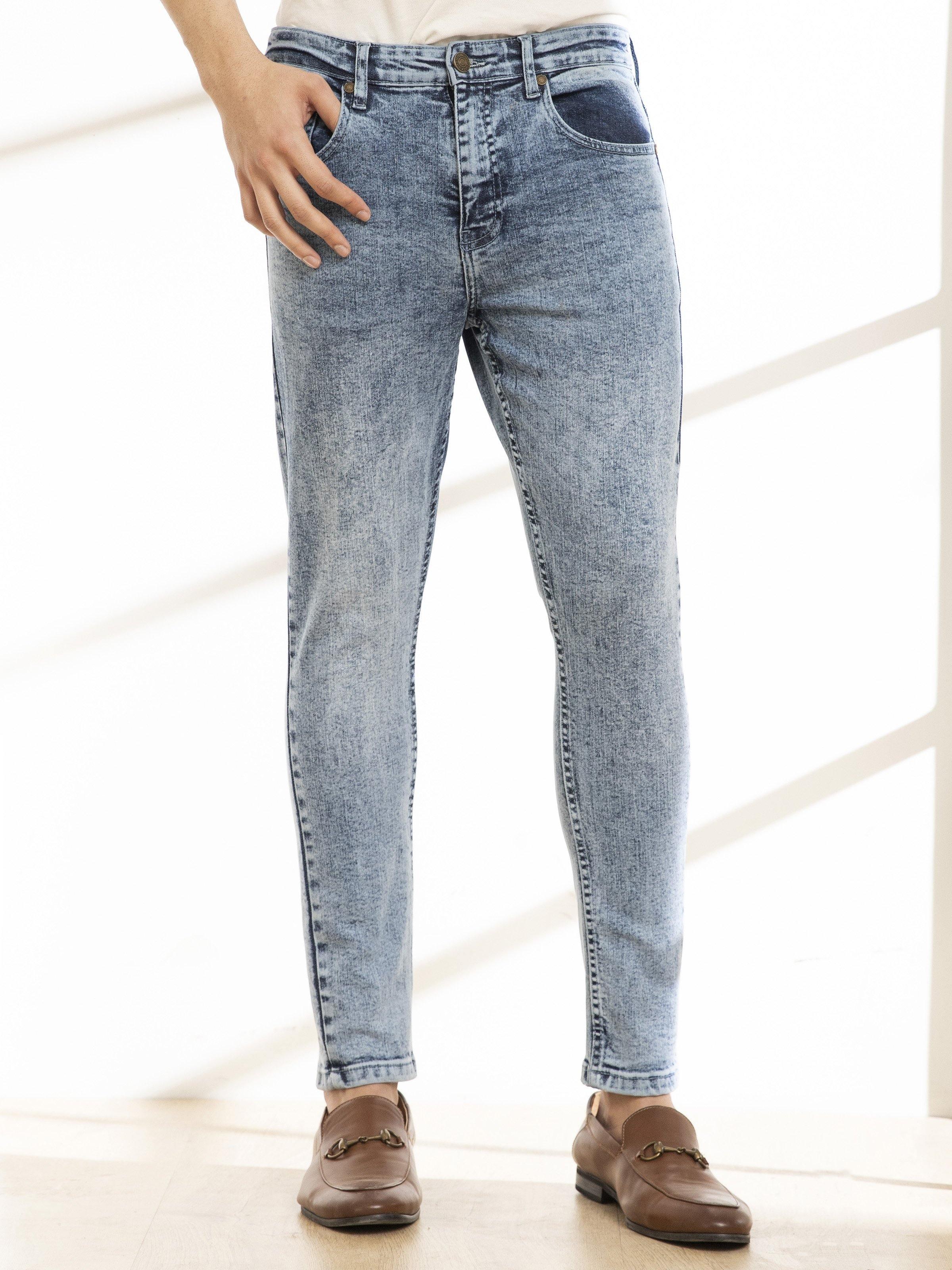 Light blue skinny jeans, straight slim legs and button fly at waistband