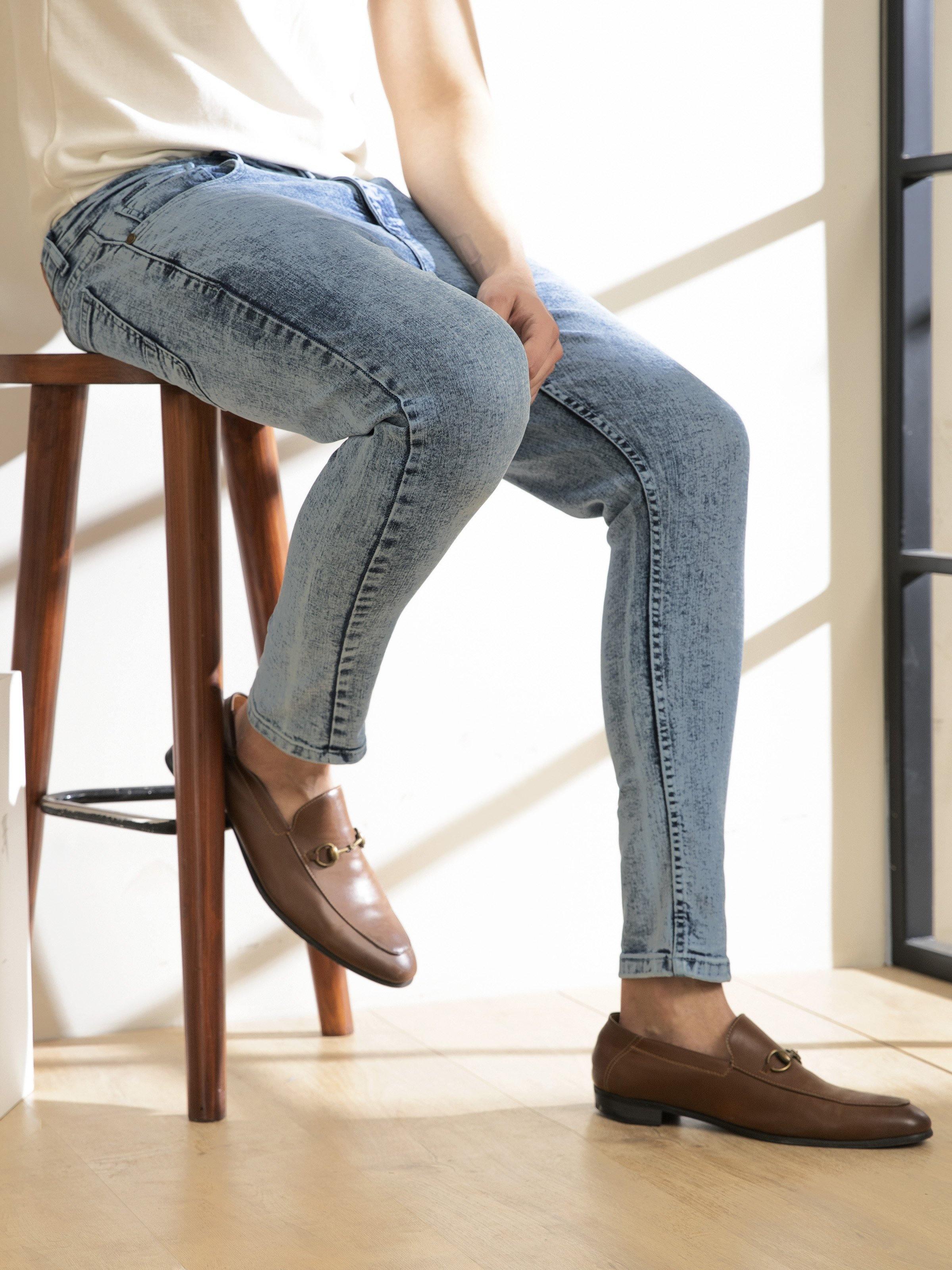 Light blue skinny jeans with contrast stitching and cuffed ankle detail