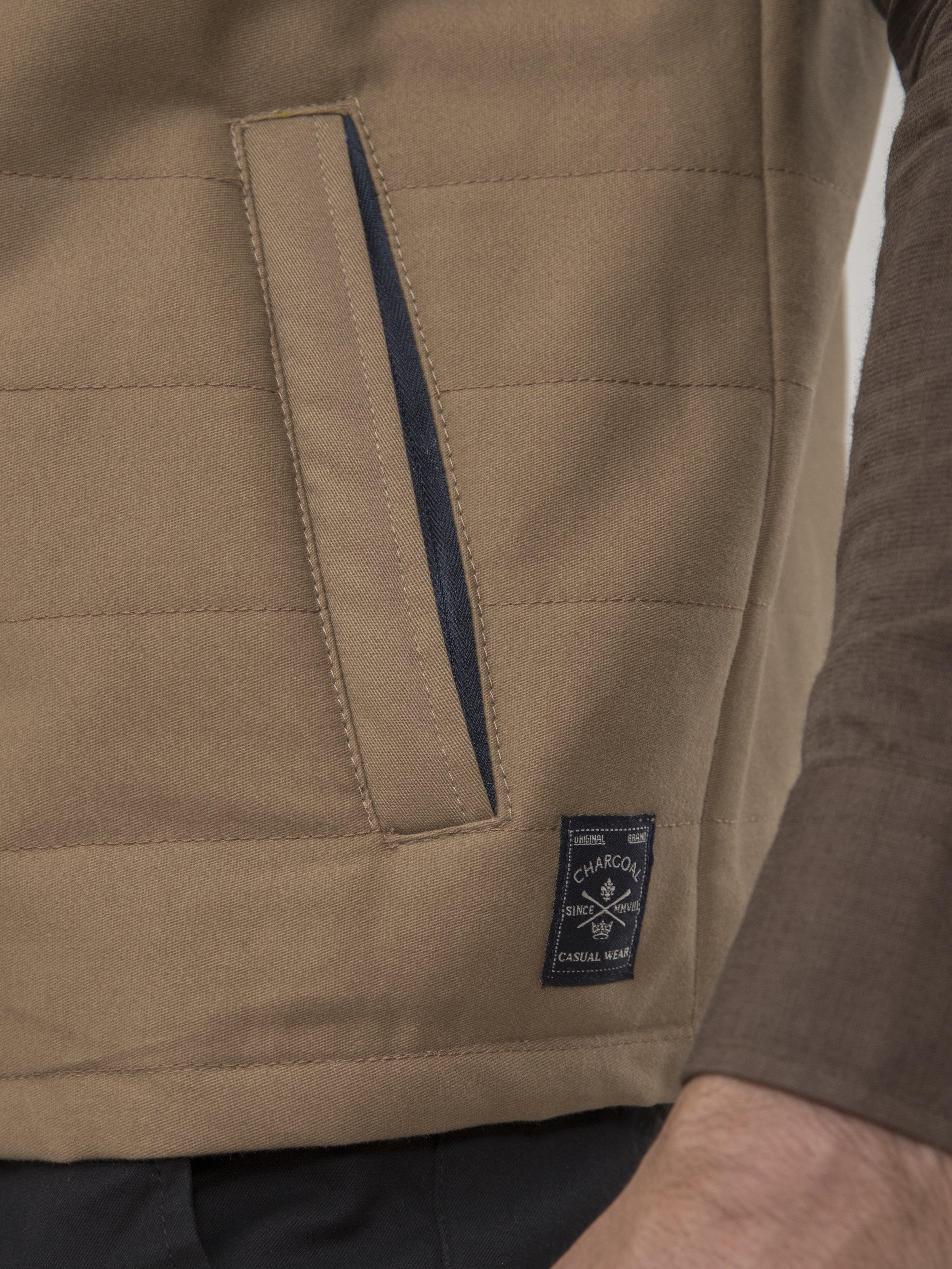 SLEEVELESS QUILTED DARK KHAKI JACKET at Charcoal Clothing