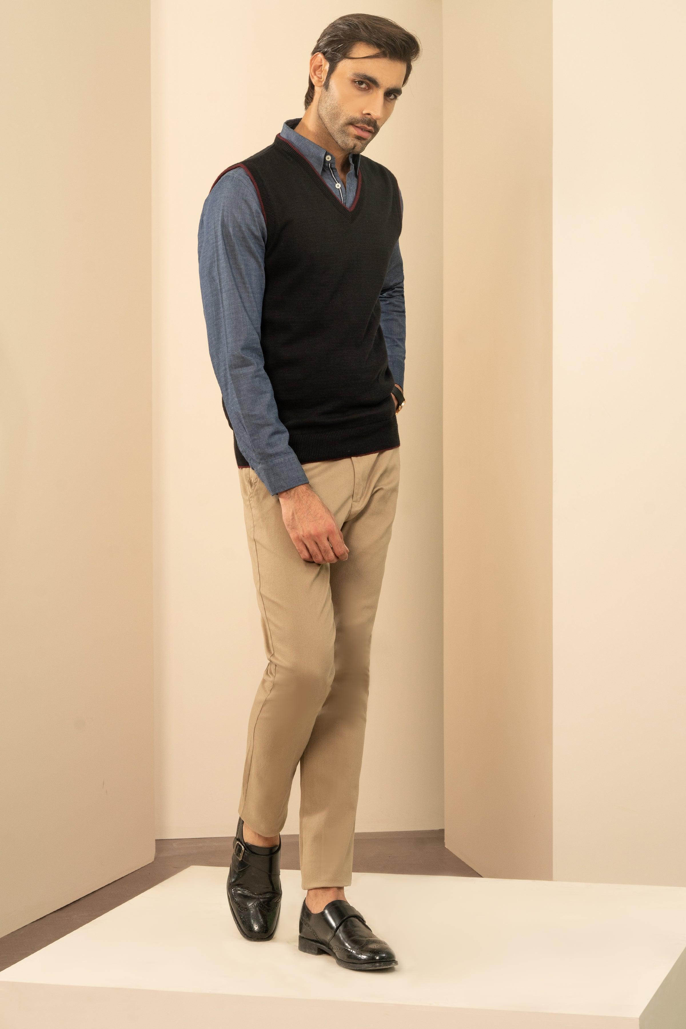 Men's black sleeveless sweater vest with V-neck and maroon trim, layered over shirt