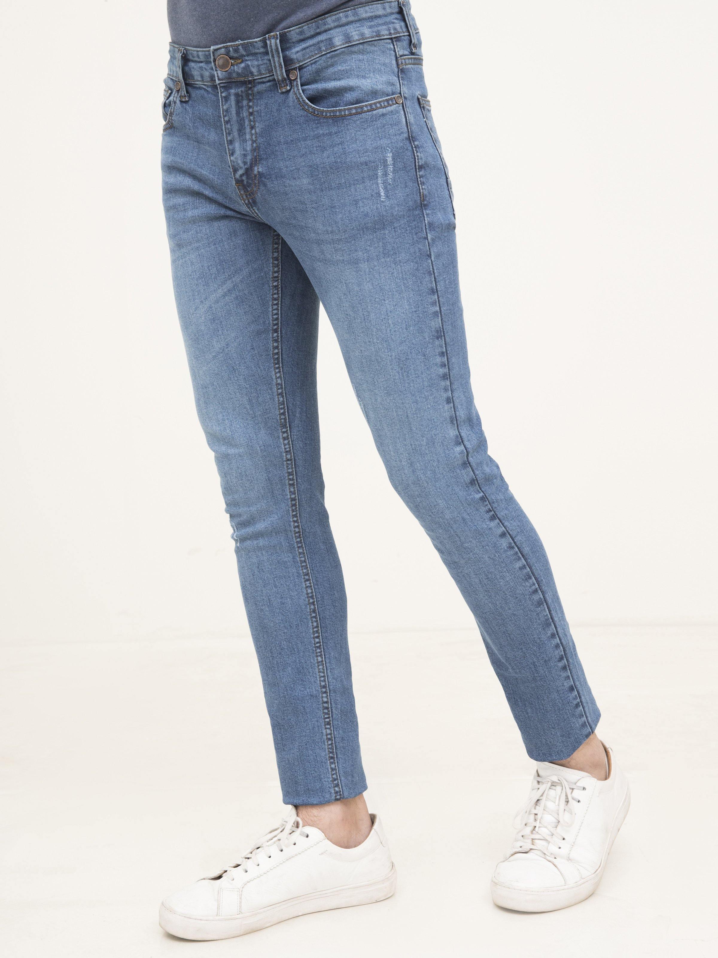 Light blue slim-fit jeans with five-pocket design and belt loops