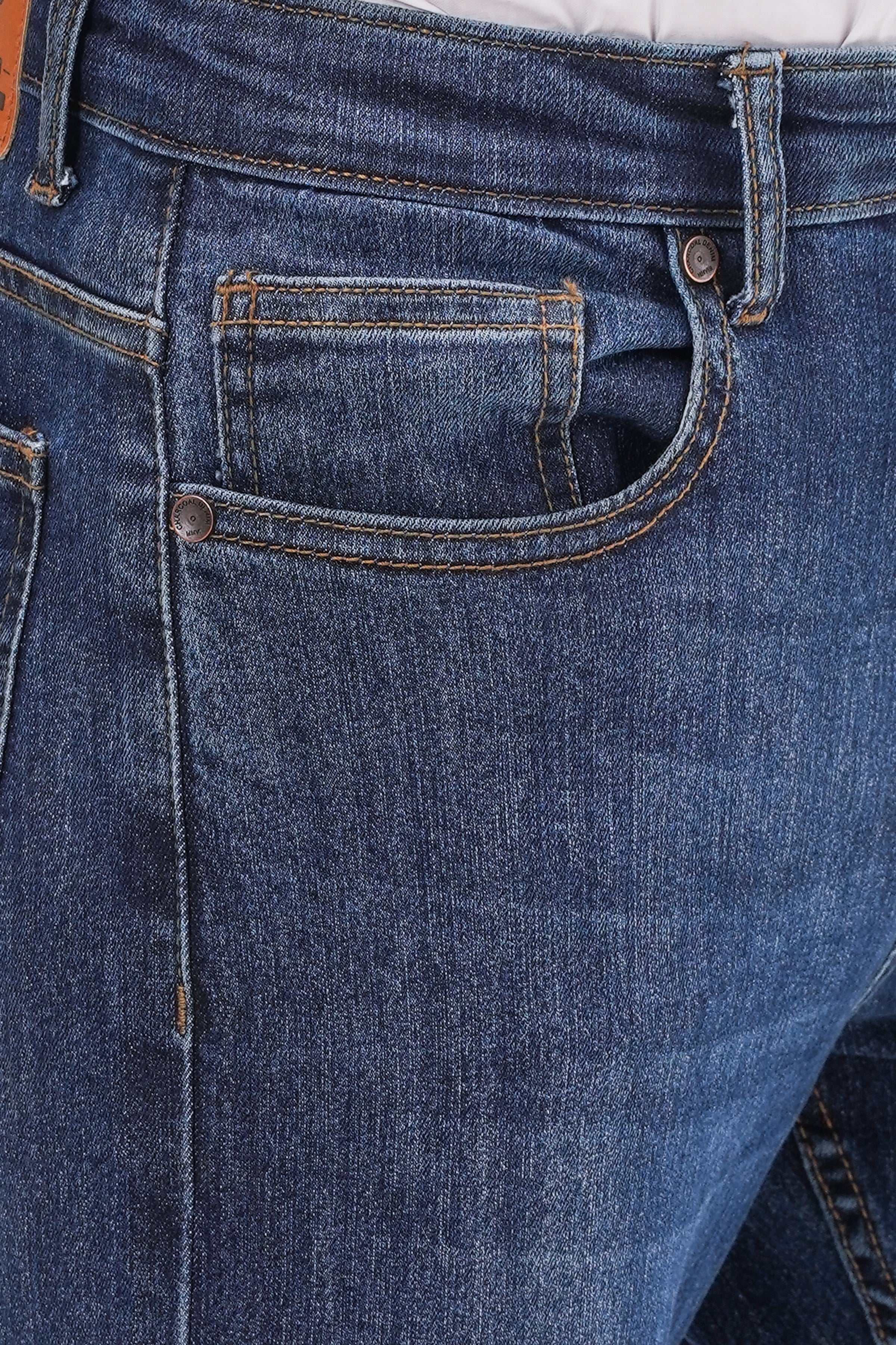 Dark blue denim jeans close-up of front pocket, coin pocket, and buttoned waistband