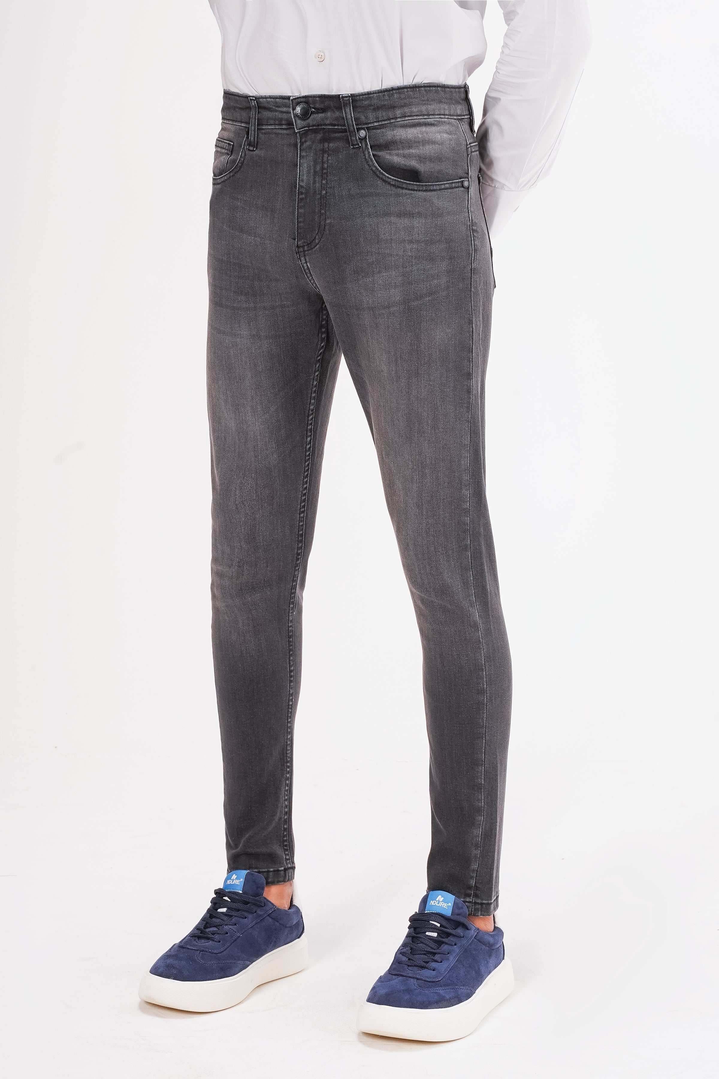 Dark grey slim-leg jeans front view with tapered legs and button closure