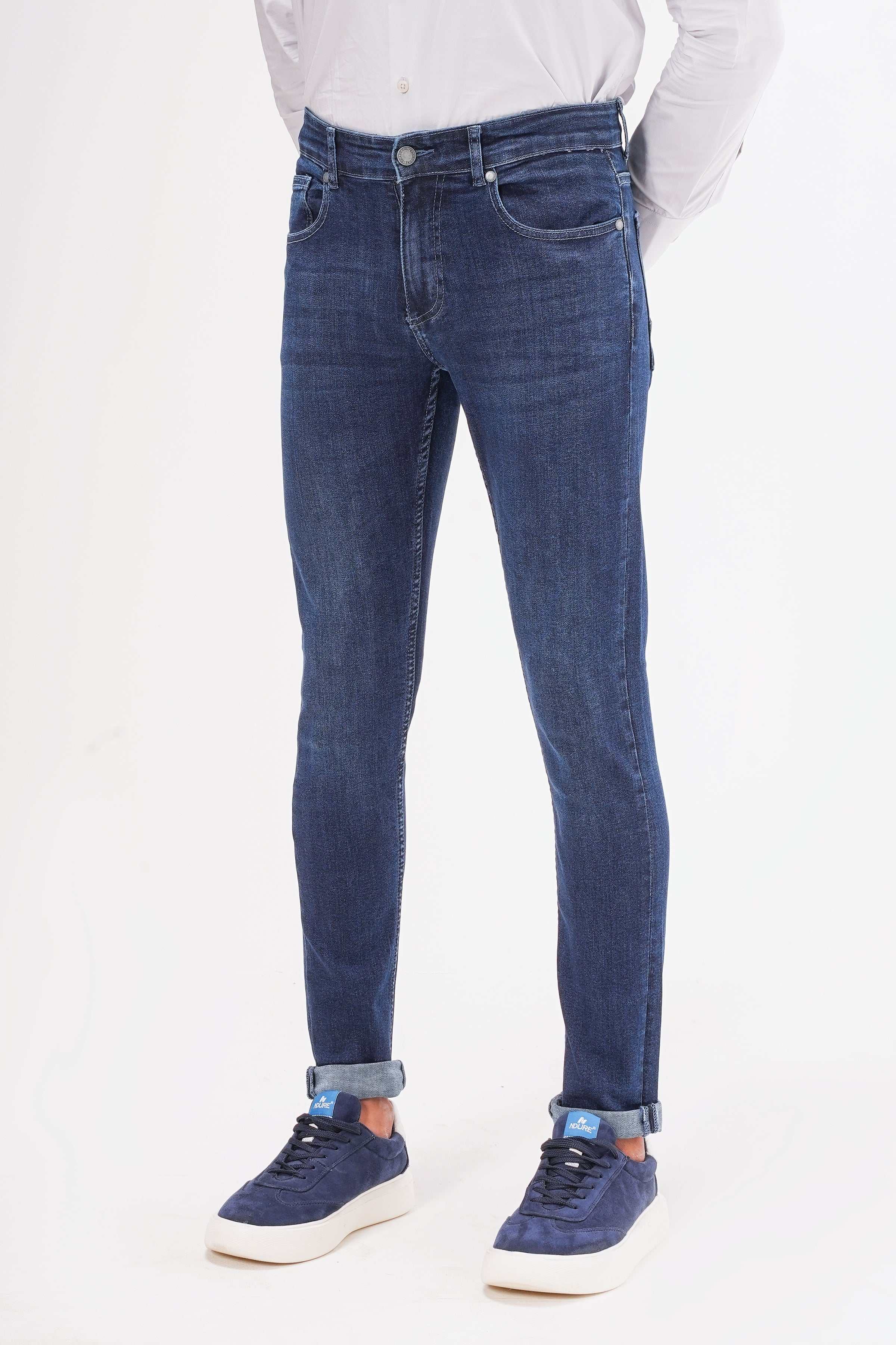 Dark navy slim-fit jeans with button waist and straight slim legs.