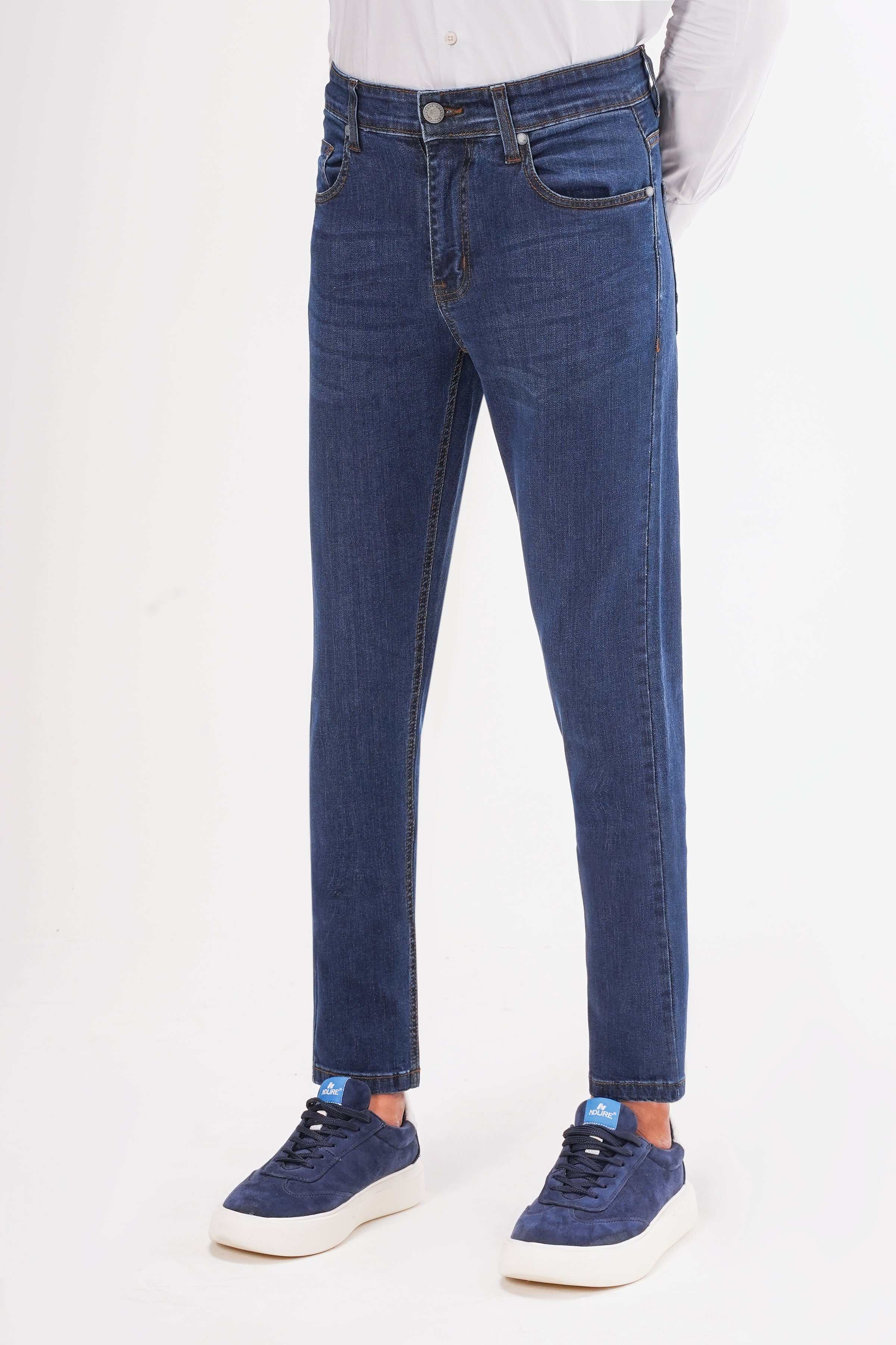 Mid-blue slim leg jeans, back view, with waistband and two back pockets.