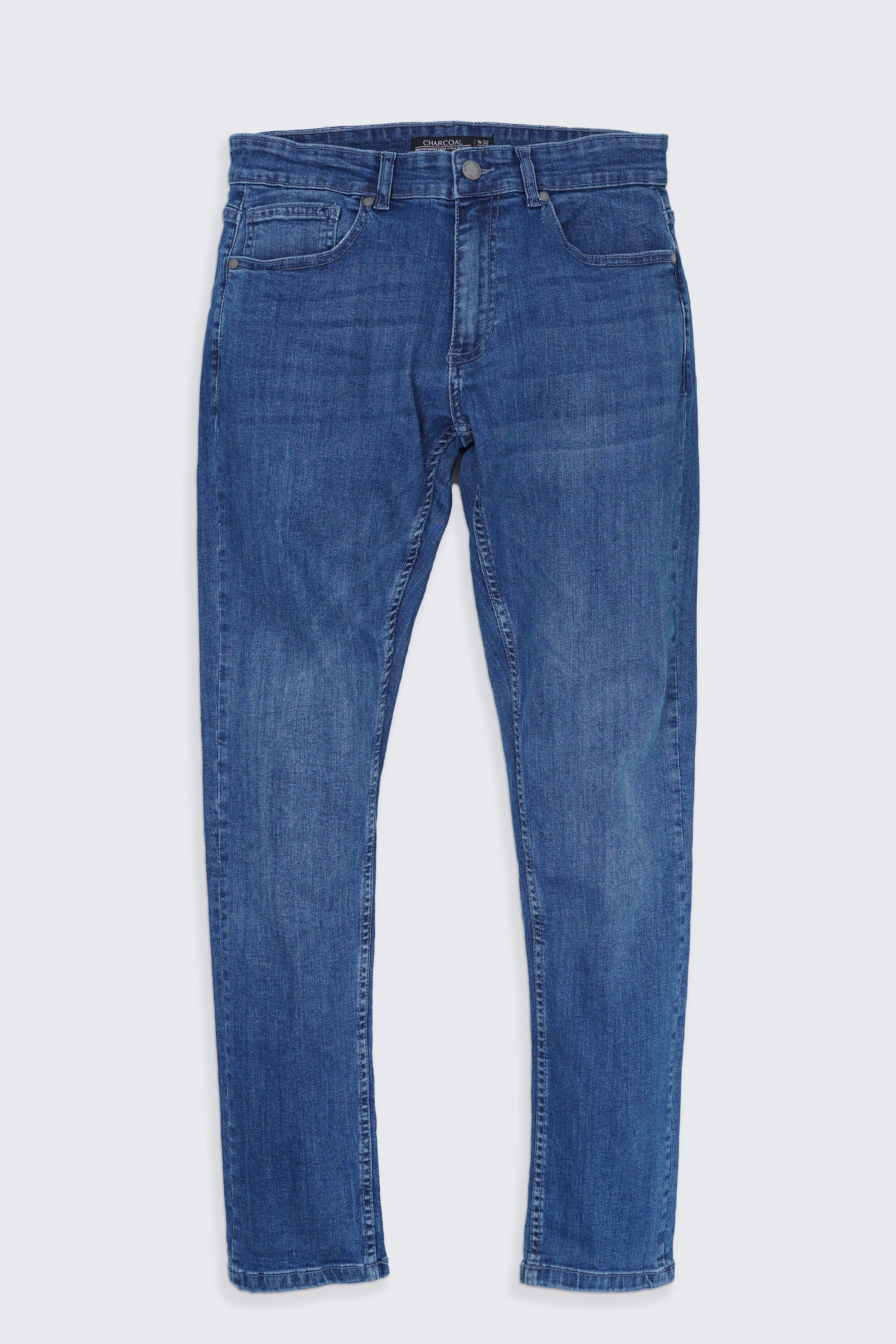 Light blue slim-leg jeans with zip fly and five-pocket design