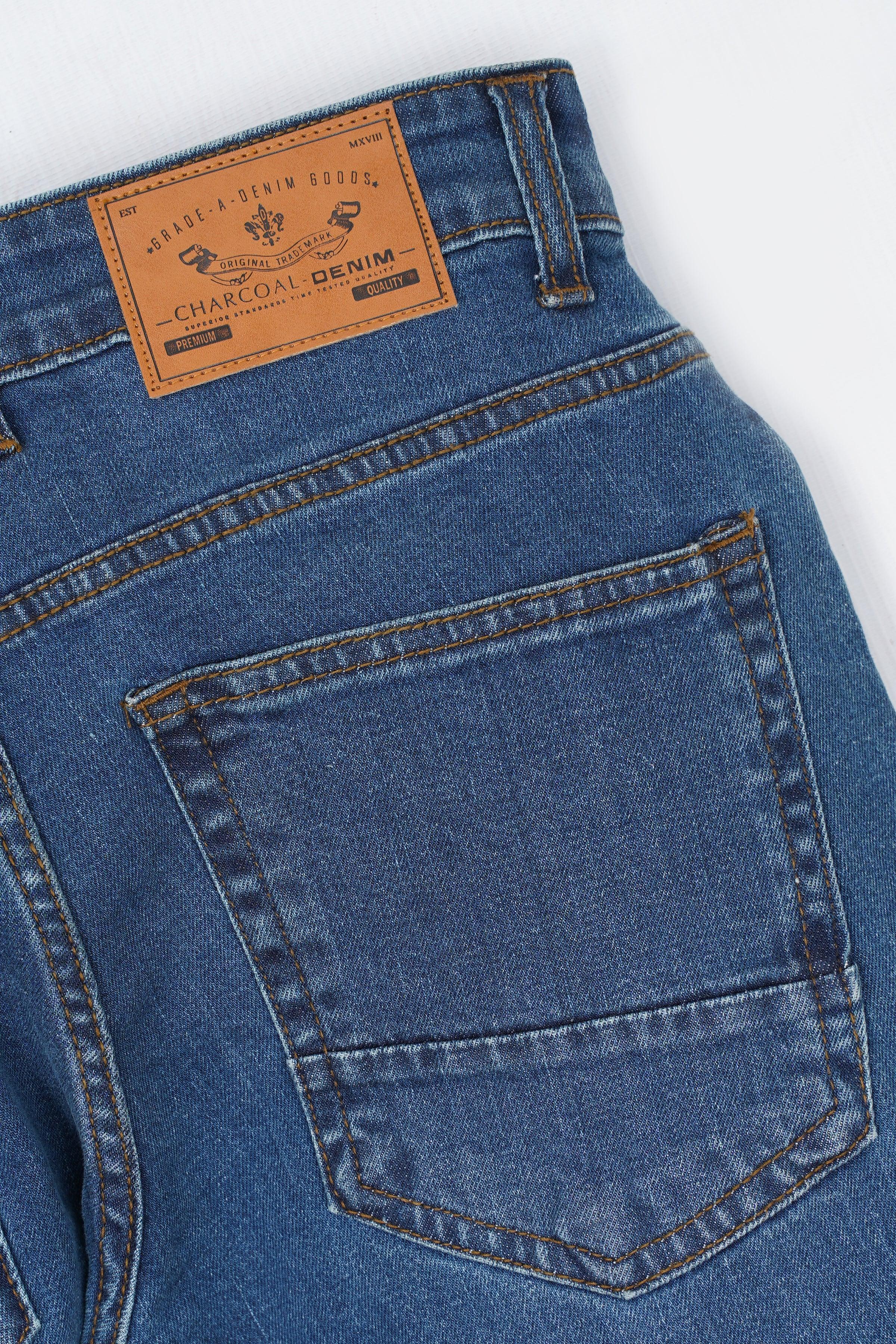 Mid-blue jeans with front patch pocket and contrast topstitching