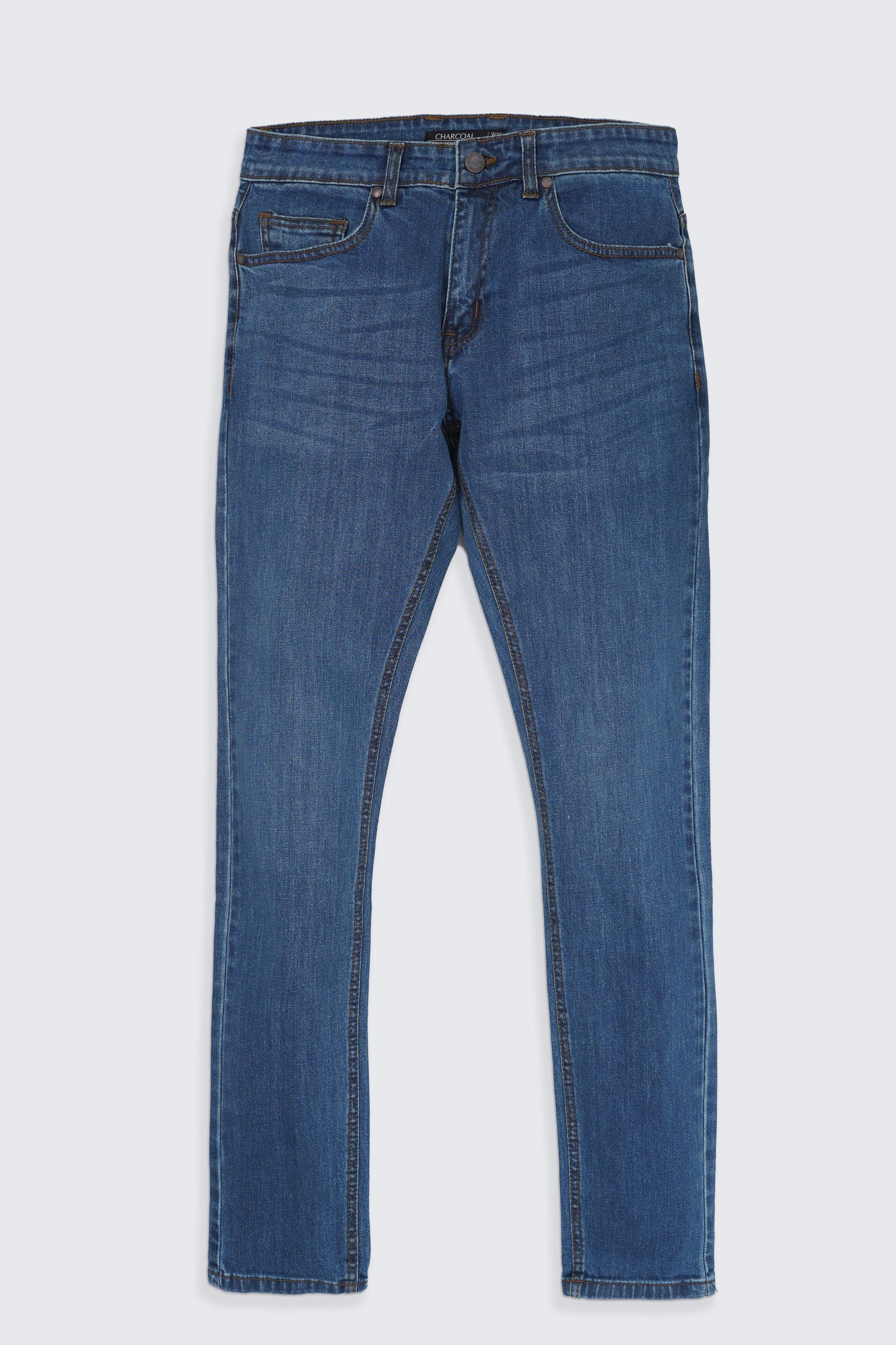 Slim-fit mid-blue jeans, five-pocket style with zip fly