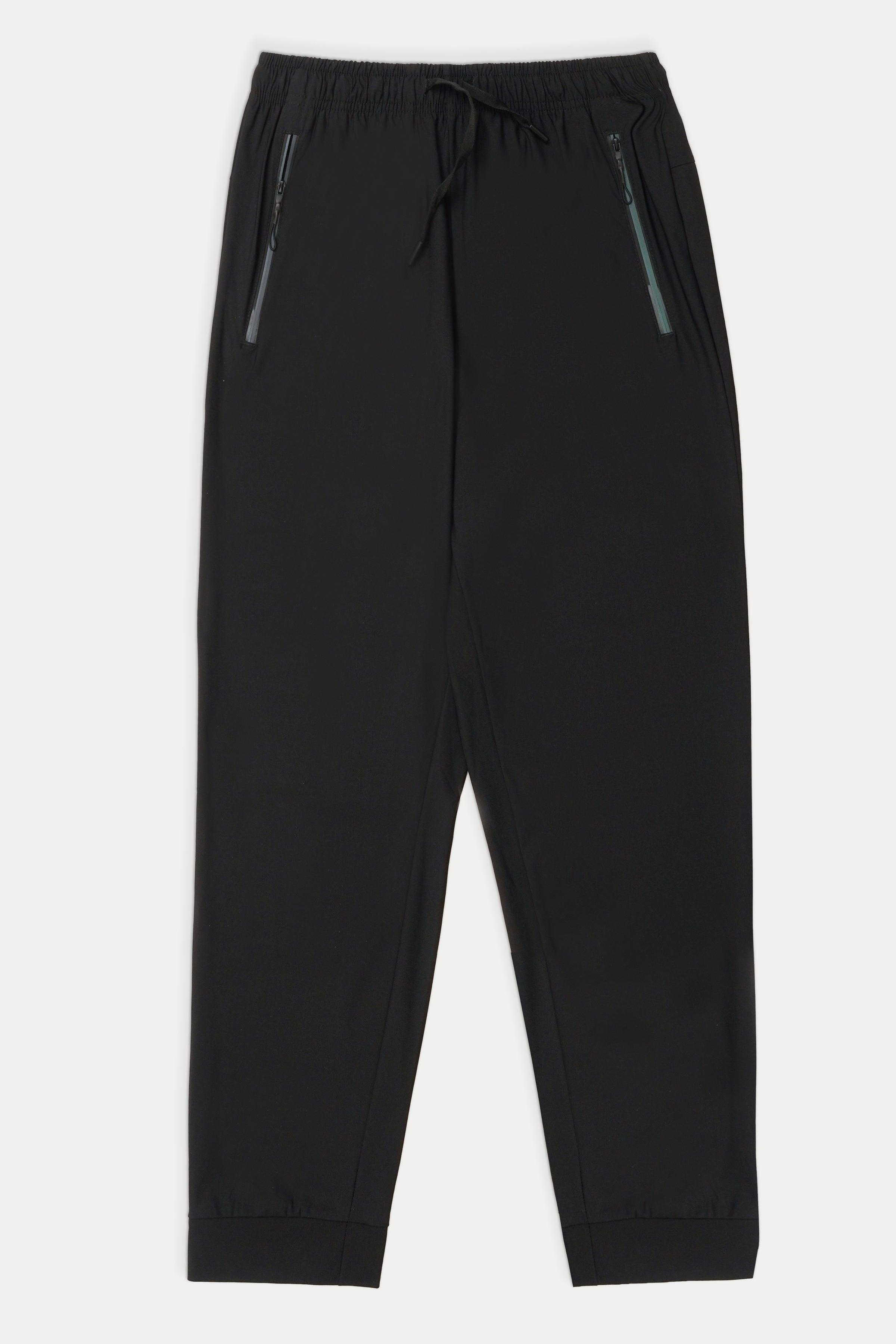 Black sports trousers with elastic waist and tapered legs